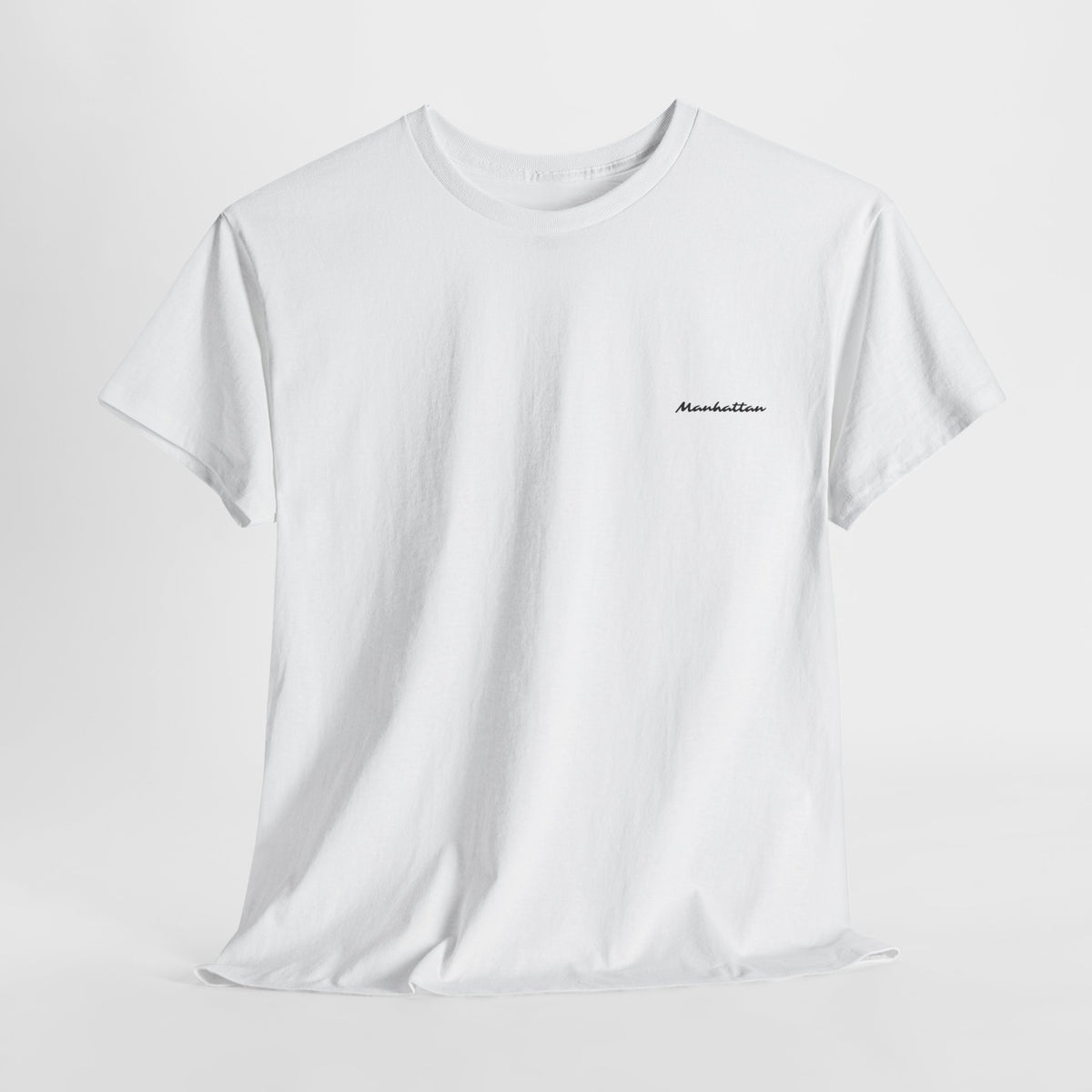 Front view of a white crewneck T-shirt with small black Manhattan script on the left chest.
