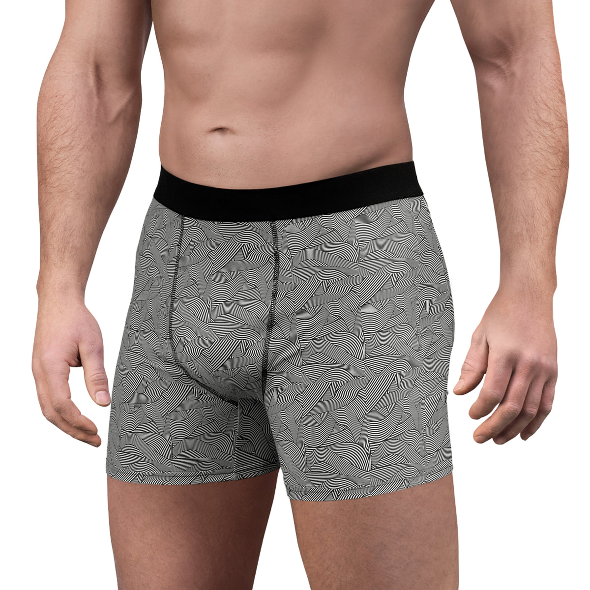 Three-quarter front view of male model wearing men's gray abstract wave print boxer briefs with a black waistband.