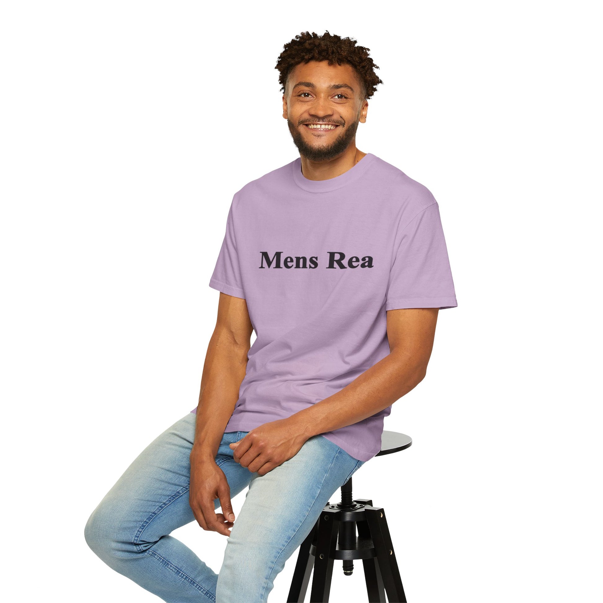 Male model sitting wearing purple Mens Rea graphic t-shirt casual streetwear outfit
