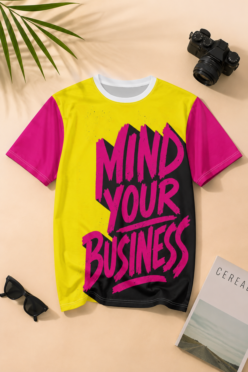 Mind Your Business graffiti graphic streetwear t-shirt showcased in an editorial flat-lay with creator and entrepreneur lifestyle accessories