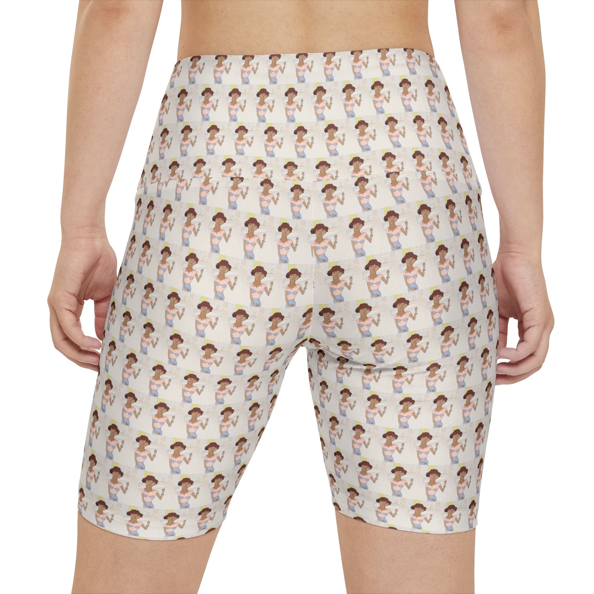 Back view of a female model wearing Morenita Art Bike Shorts showcasing the original illustrated pattern and high-waisted silhouette.