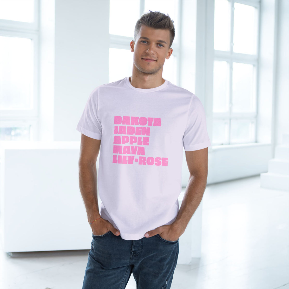 Man wearing lavender Nepo Babies List T-shirt with pink lettering