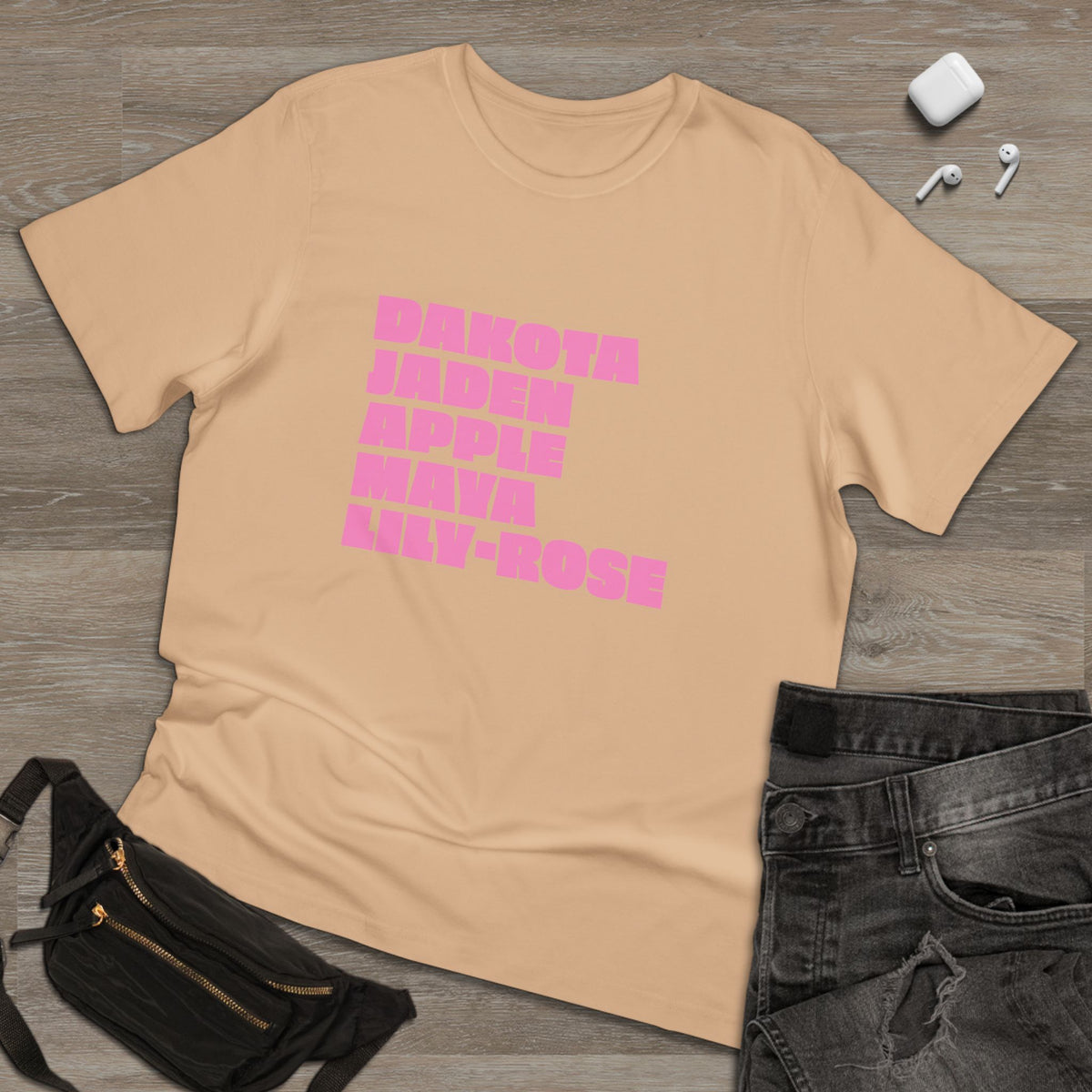 Tan Nepo Babies List T-shirt flat lay with bright pink typography