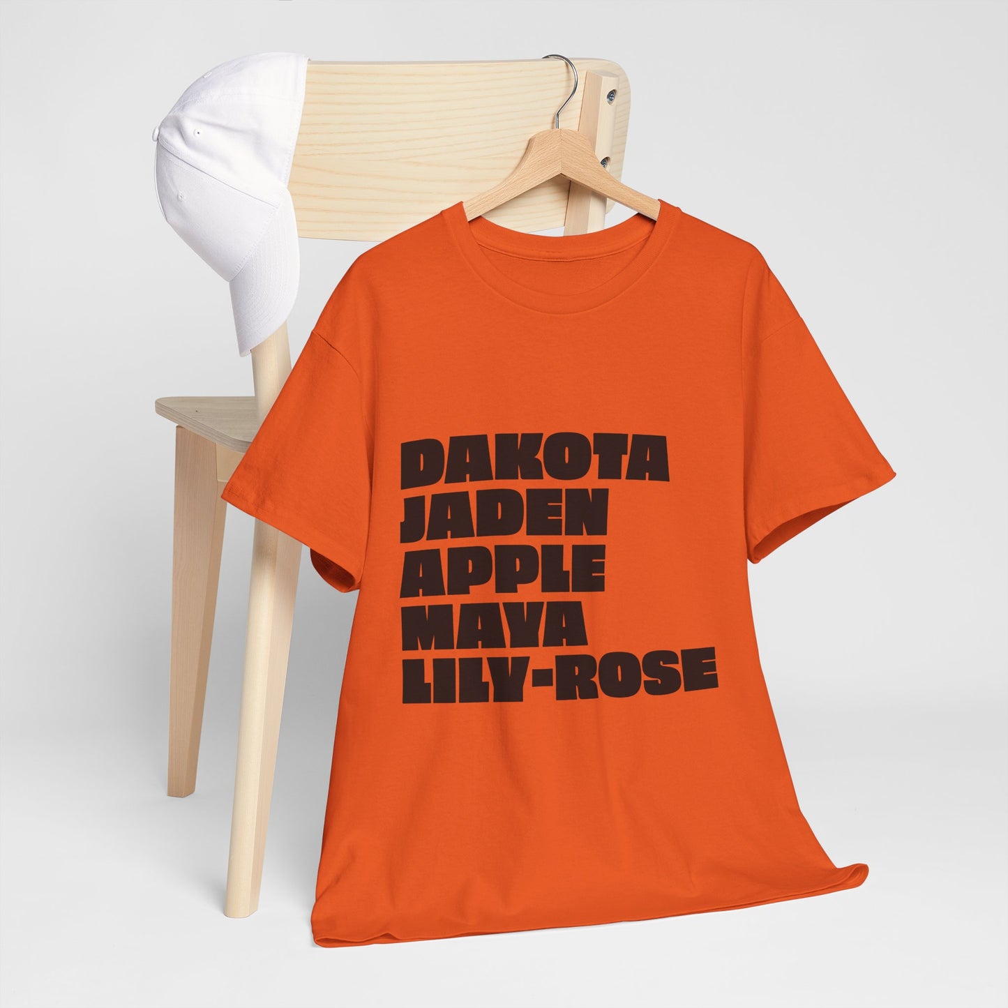 Orange Nepo Babies List unisex t-shirt with bold black text, modern studio product shot