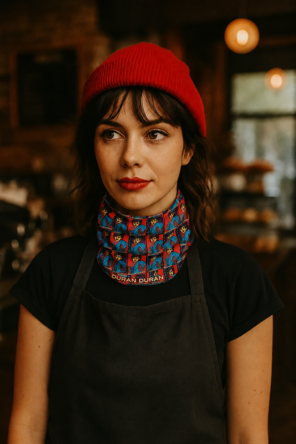 Woman in a café wearing the Nick Rhodes Unisex