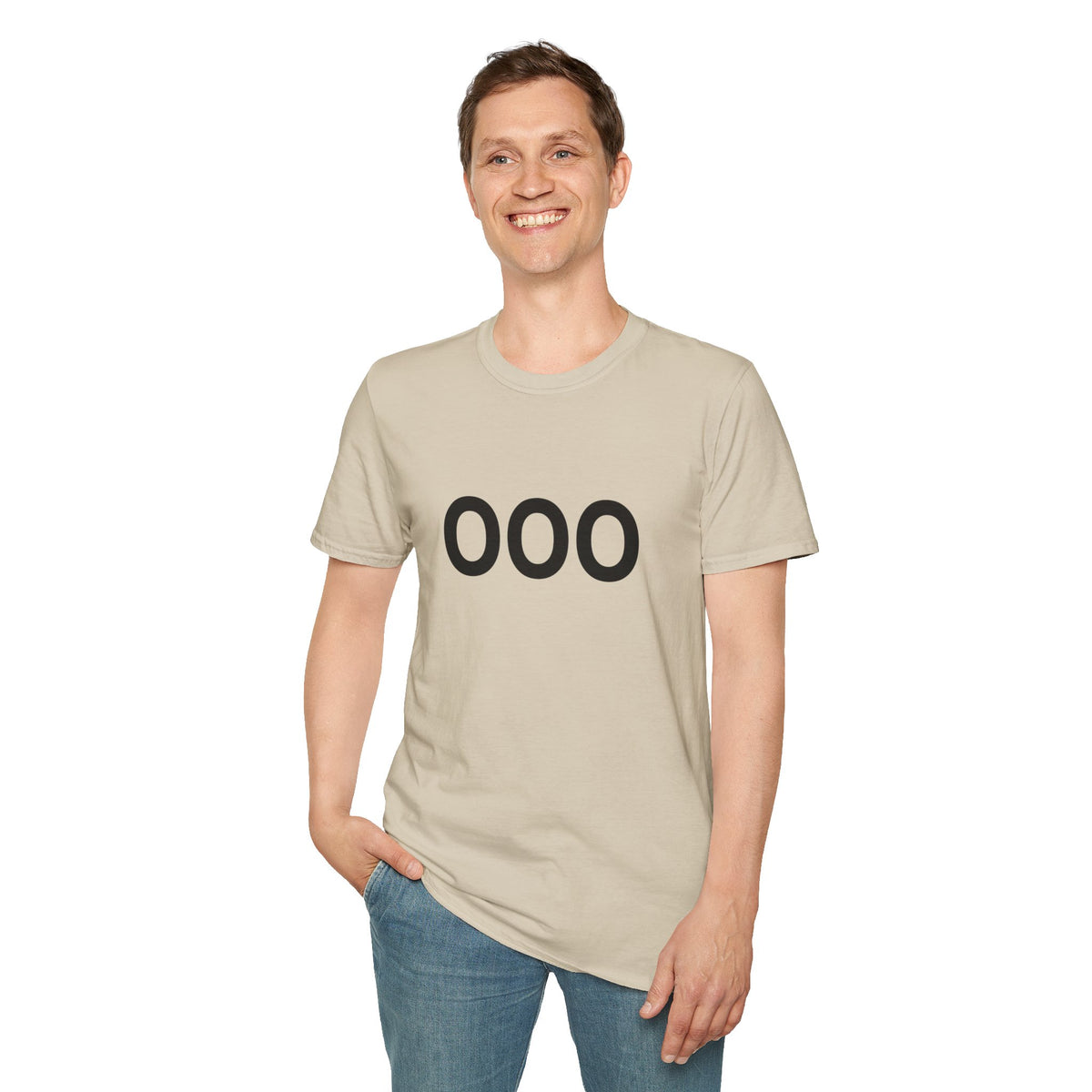 Man modeling a cream OOO graphic T-shirt with blue jeans.
