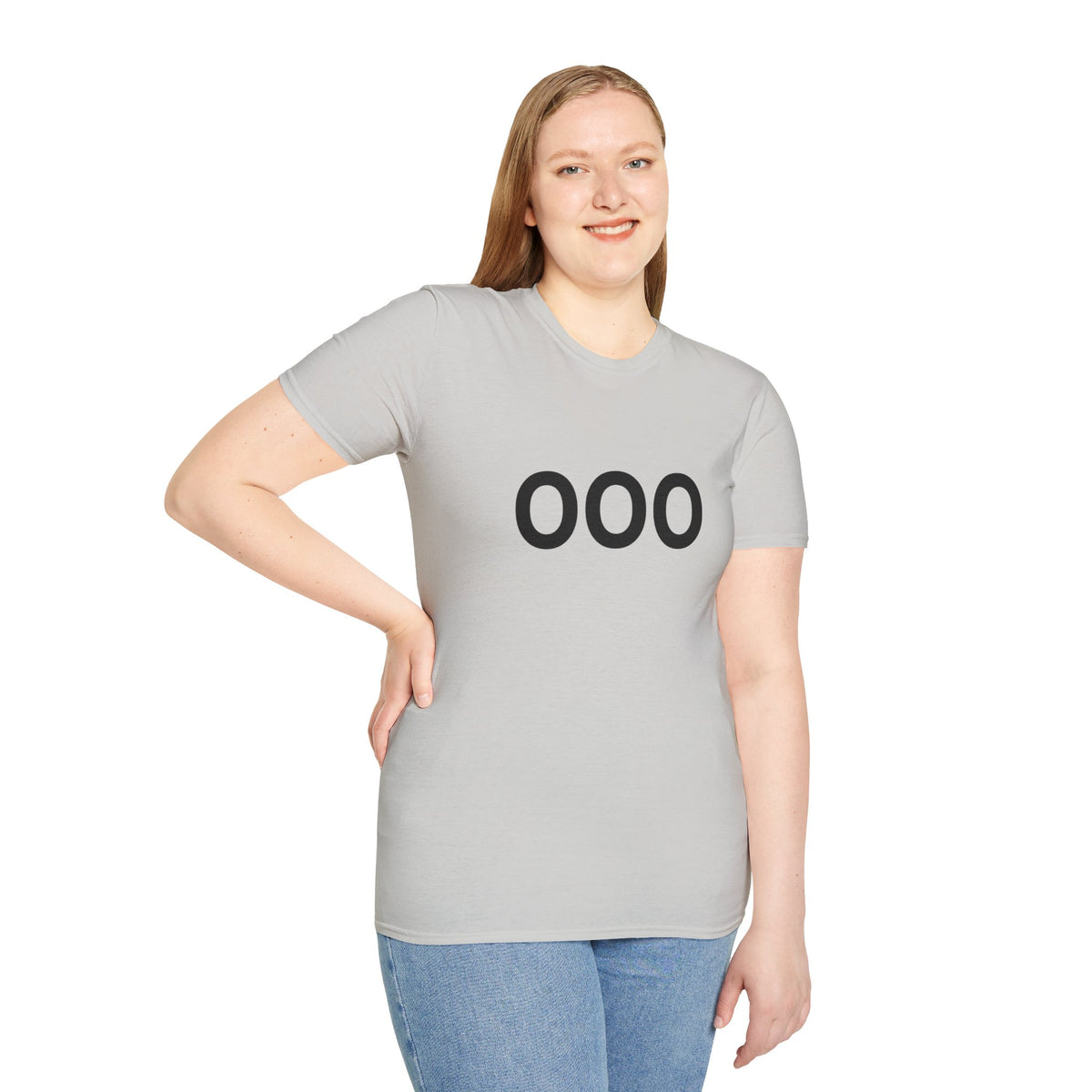 Woman wearing a light gray OOO T-shirt with one hand resting on her hip.