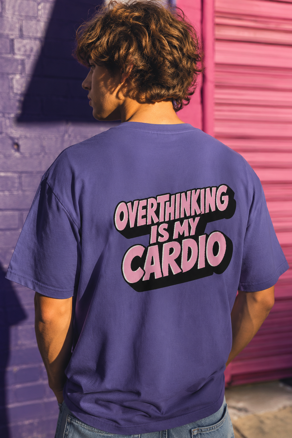 Editorial lifestyle of model wearing purple Overthinking Is My Cardio graphic T-shirt