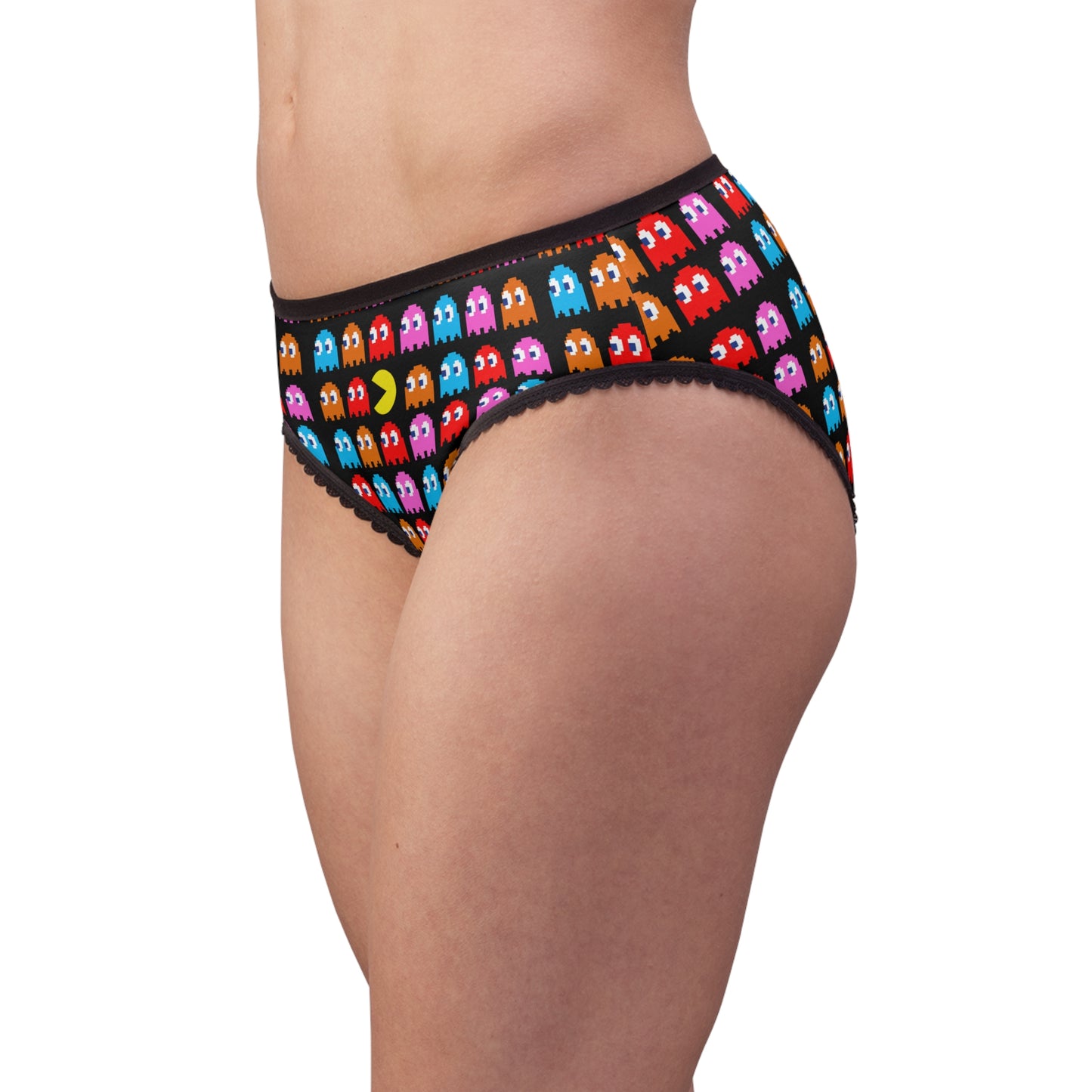 Side view of model wearing Pac-Man women’s briefs with colorful pixel ghost print and black lace trim