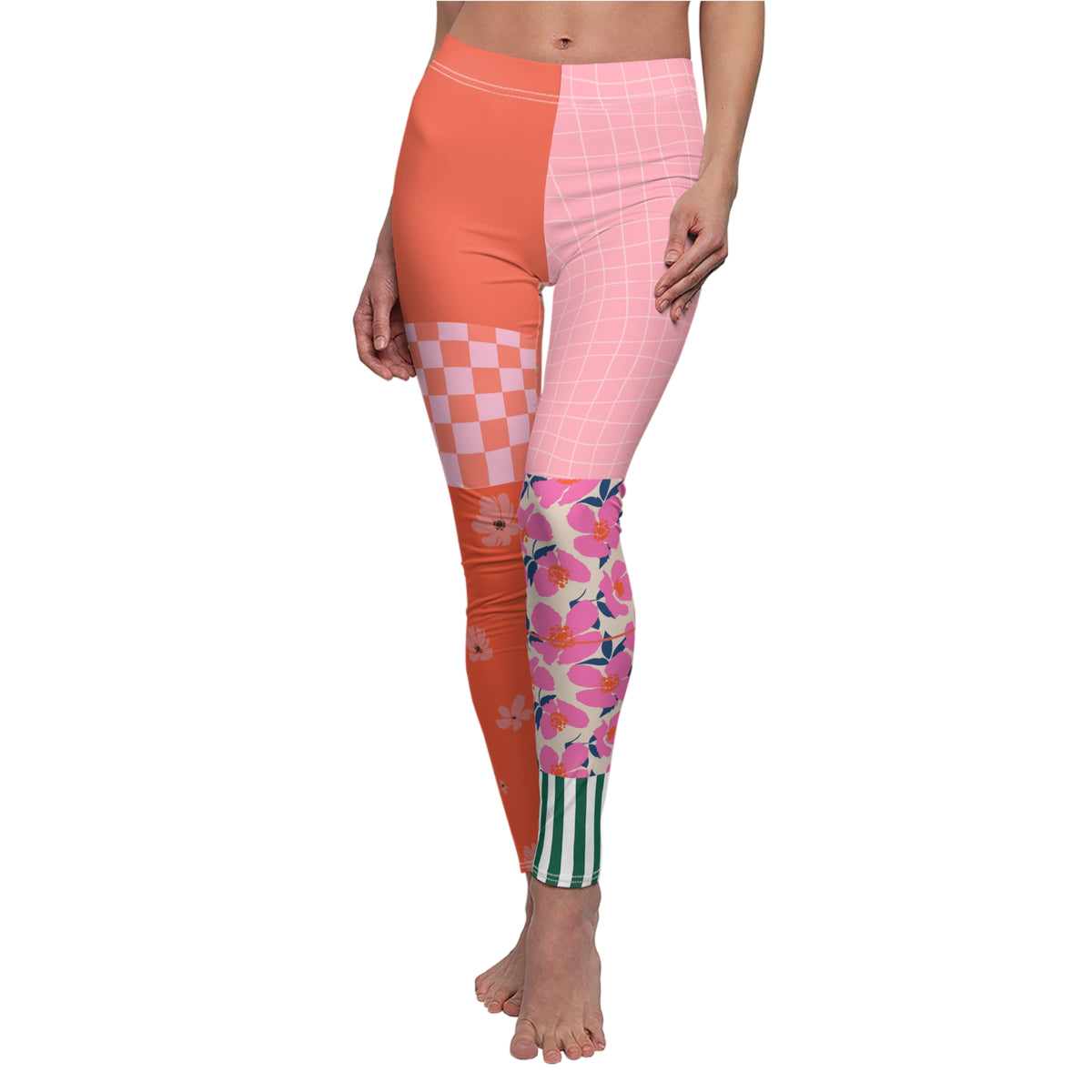 Front view of Patchwork Flowers leggings with coral checkerboard, pink grid, floral calf panels, and green-striped ankle detail.