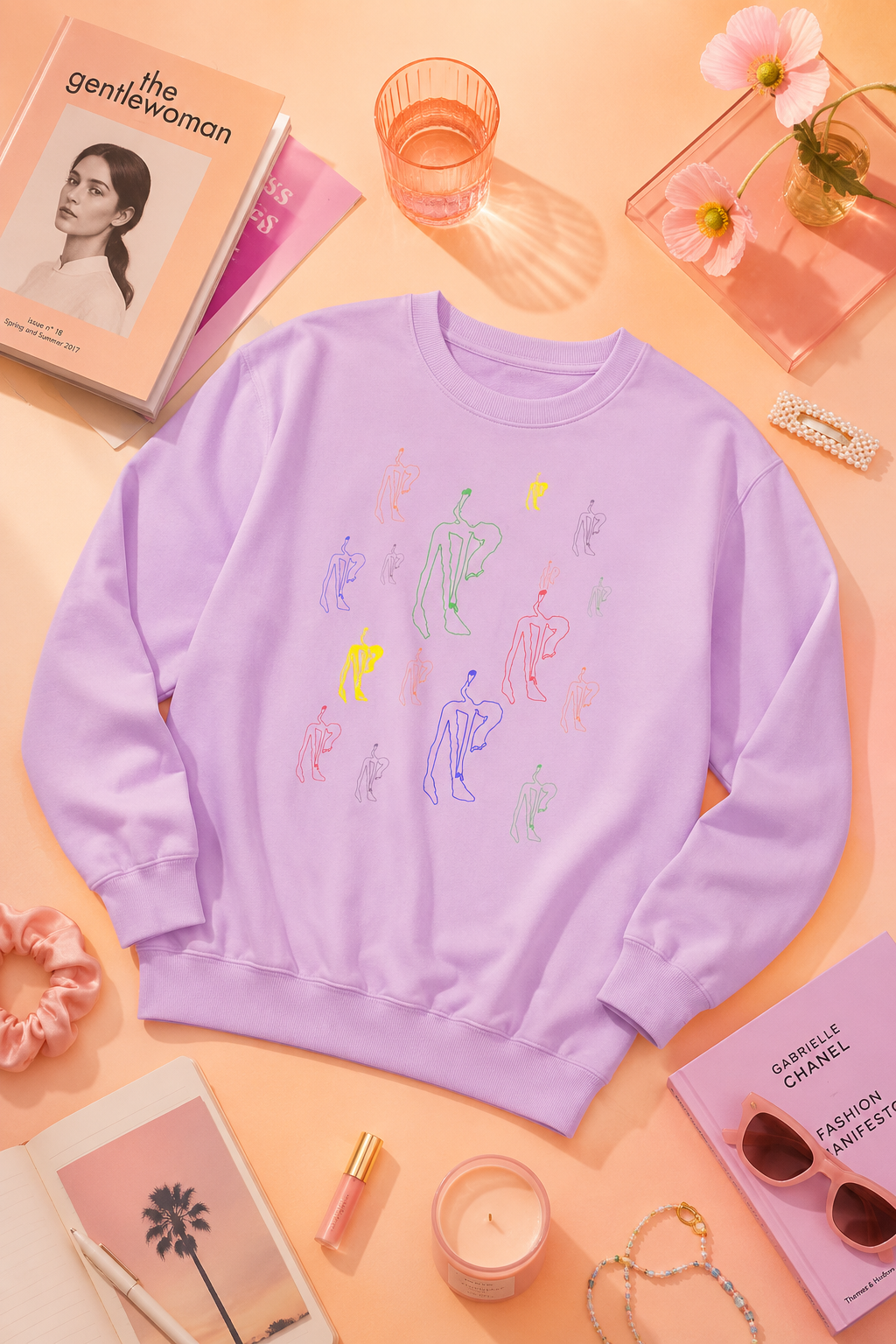 Flat lay of the Patsy Unisex Sweatshirt in lavender with original hand-drawn artwork