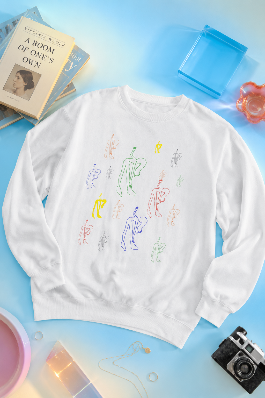 Flat lay of the white Patsy Unisex Sweatshirt with original artwork by @socialtantrum