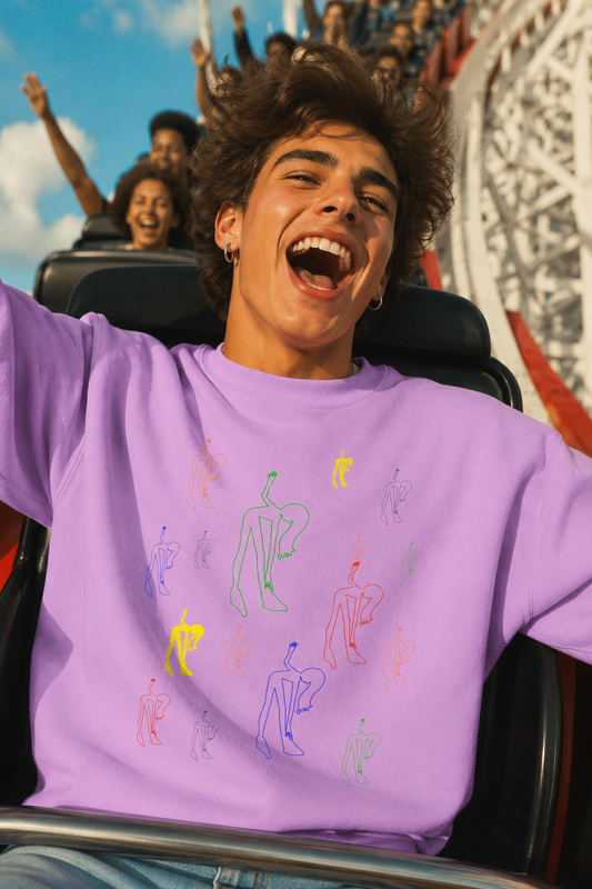 Young man wearing the Patsy Unisex Sweatshirt on a roller coaster, featuring original artwork by NYC artist @socialtantrum