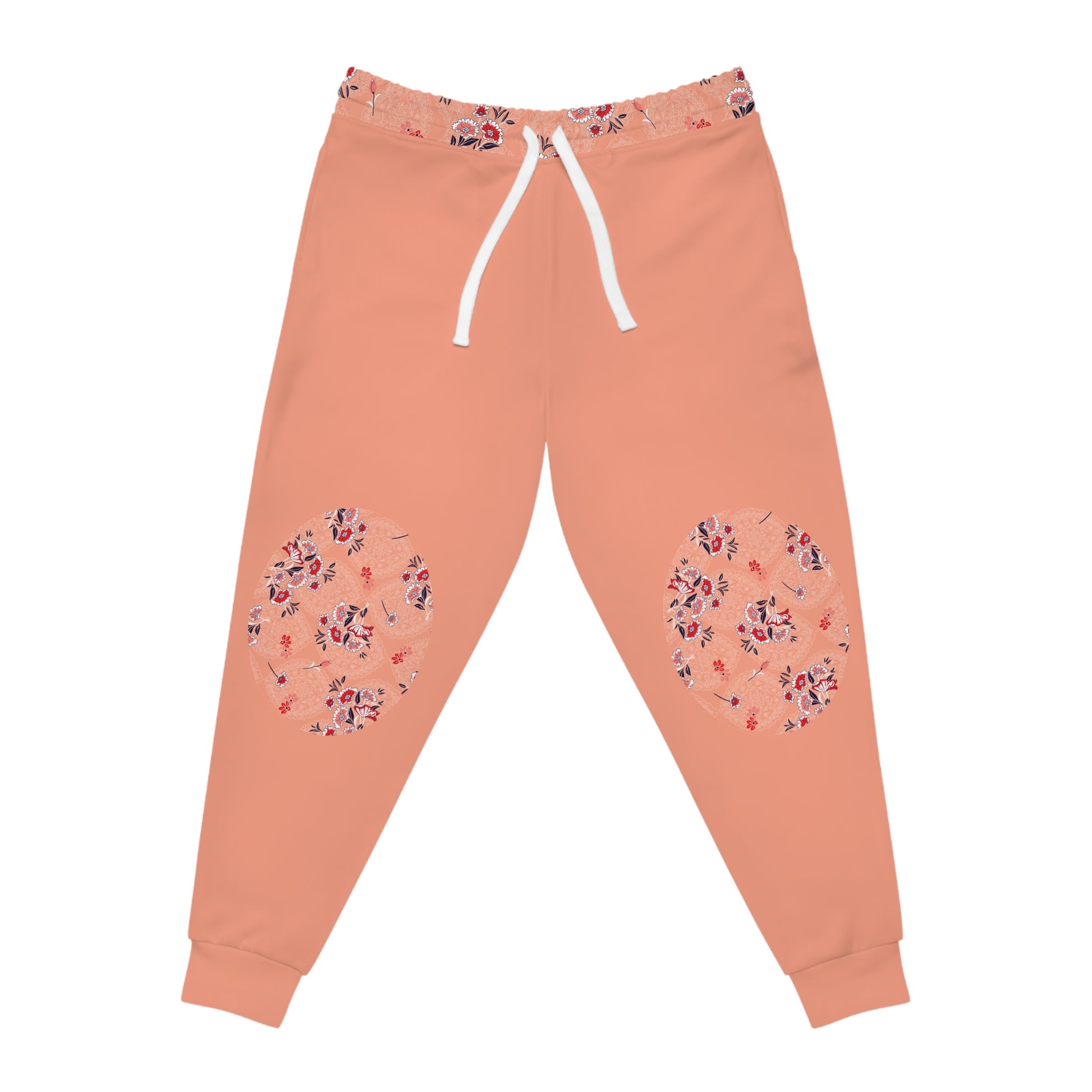Front view of peach floral joggers featuring floral knee patch details