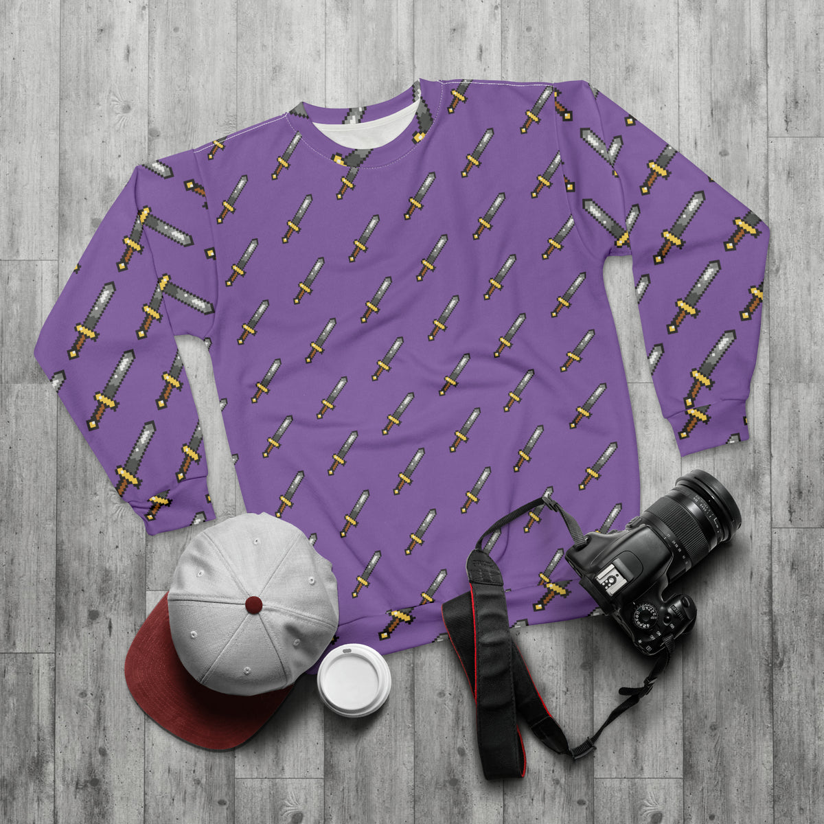 Flat lay of purple pill pattern sweatshirt styled with casual accessories
