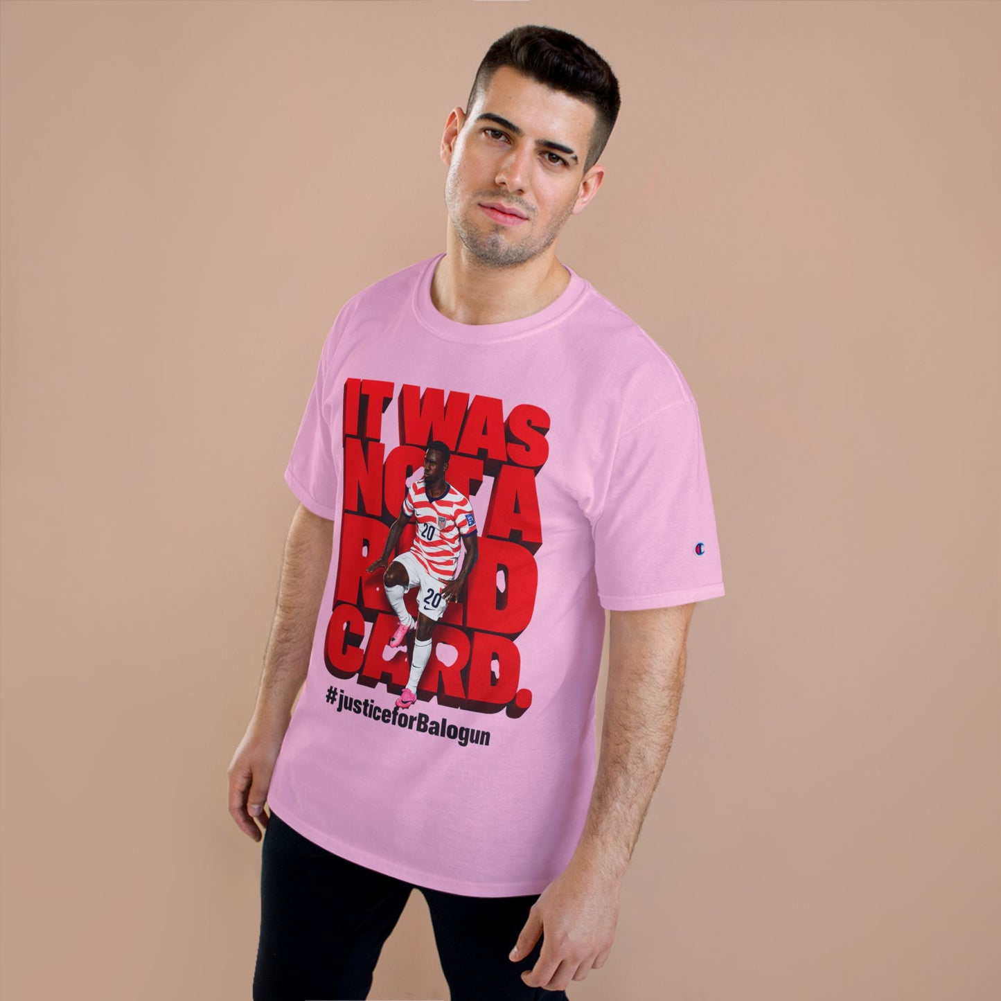 male model wearing pink Balogun soccer protest graphic t-shirt