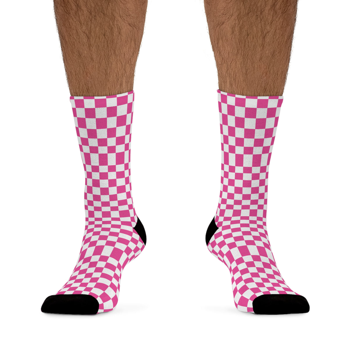 Male model wearing pink checkerboard graphic crew socks from the front.