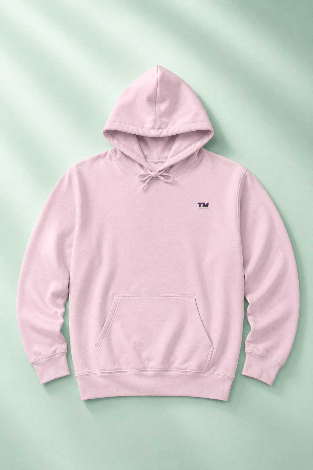 Tantrum Media EcoSmart pink hoodie flat lay on a soft mint pastel background.