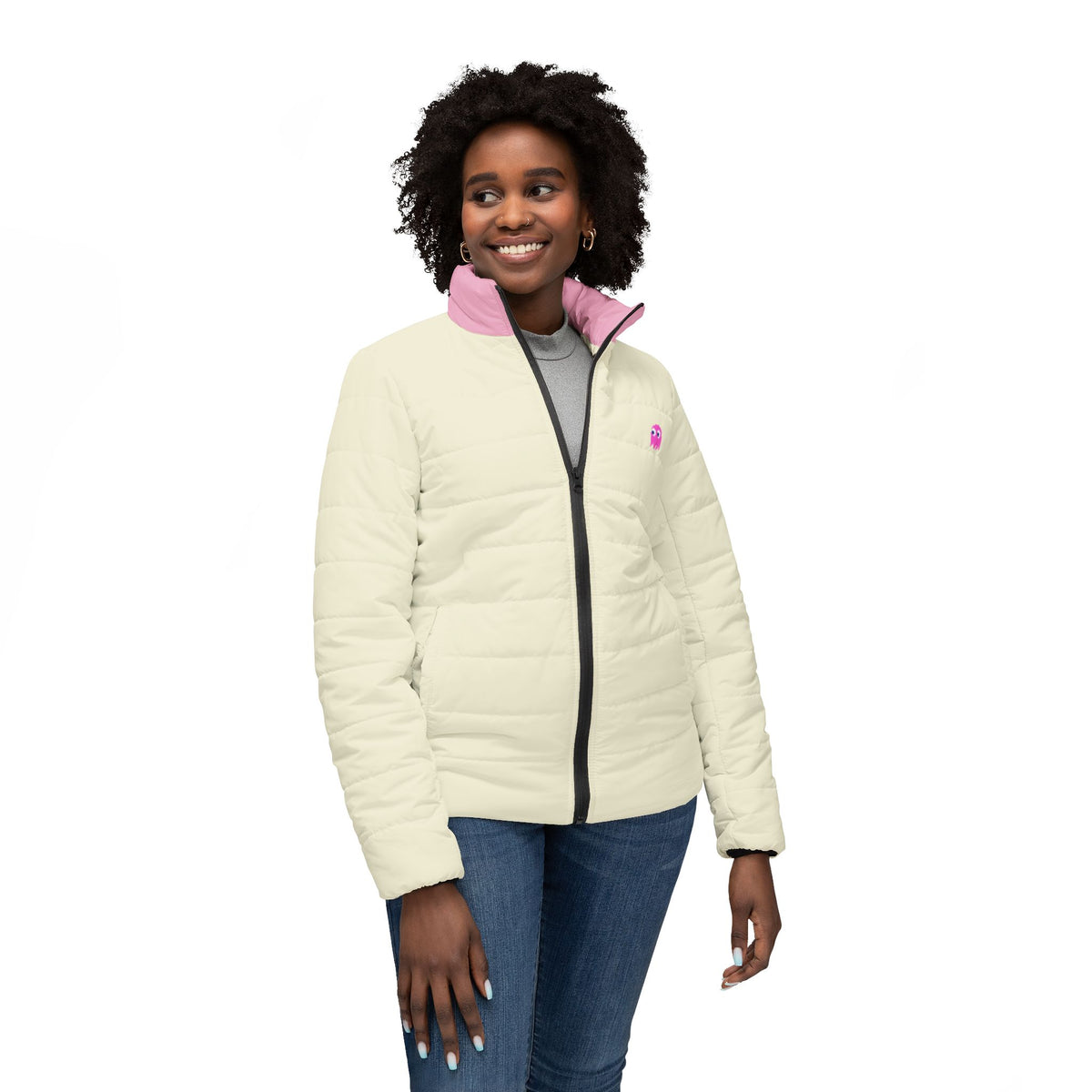 Woman modeling cream gaming puffer jacket with pink collar and pixel ghost graphic