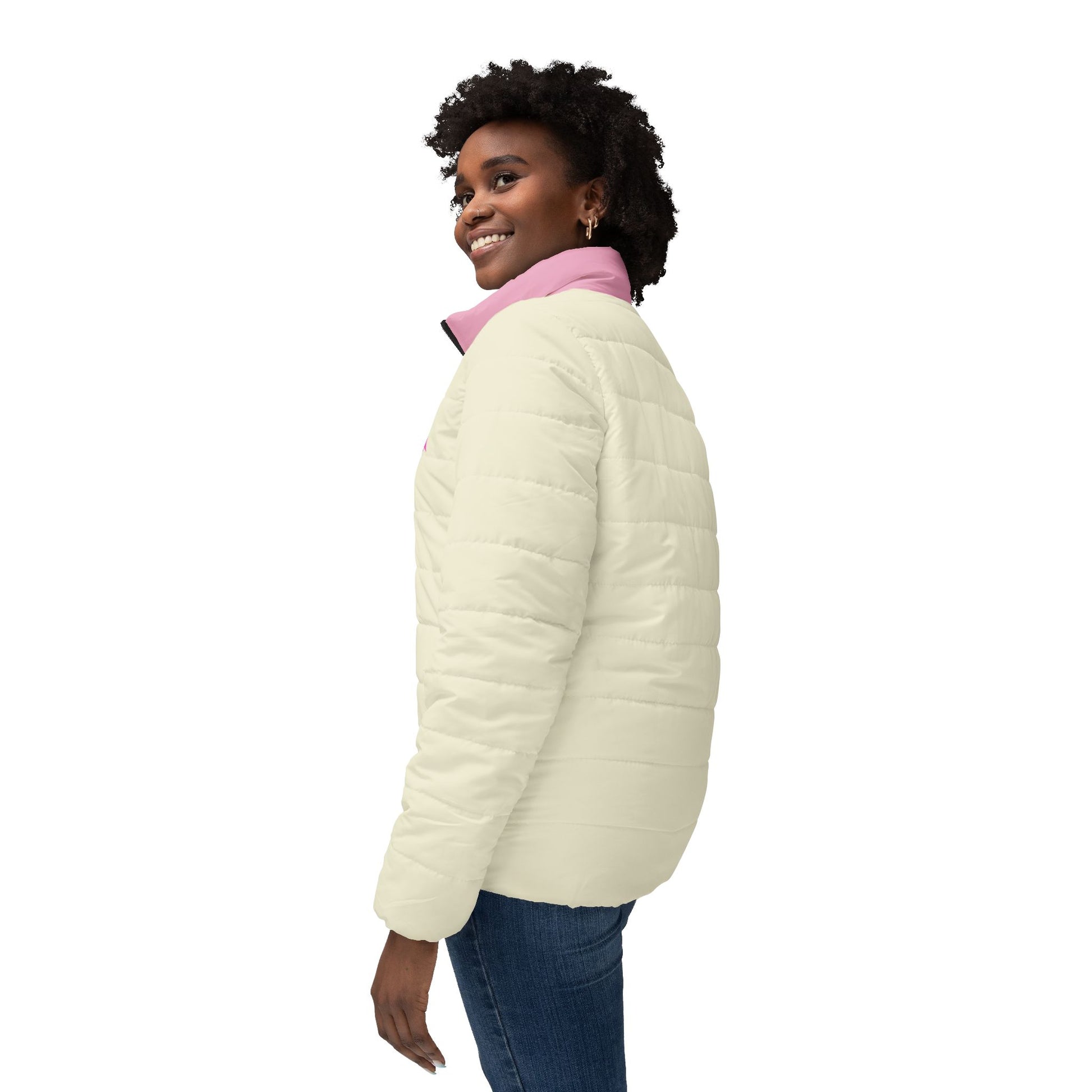 Three-quarter view of woman wearing cream and pink pixel ghost gaming puffer jacket