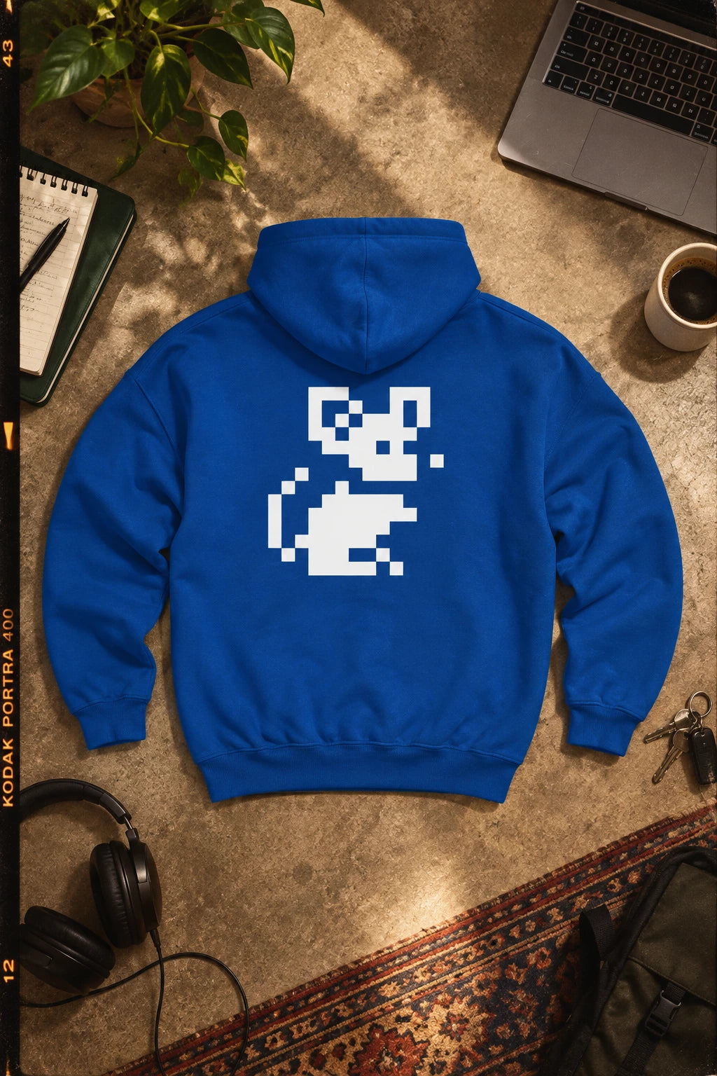 Blue Pixel Mouse Zip Hoodie back view cinematic editorial flat lay