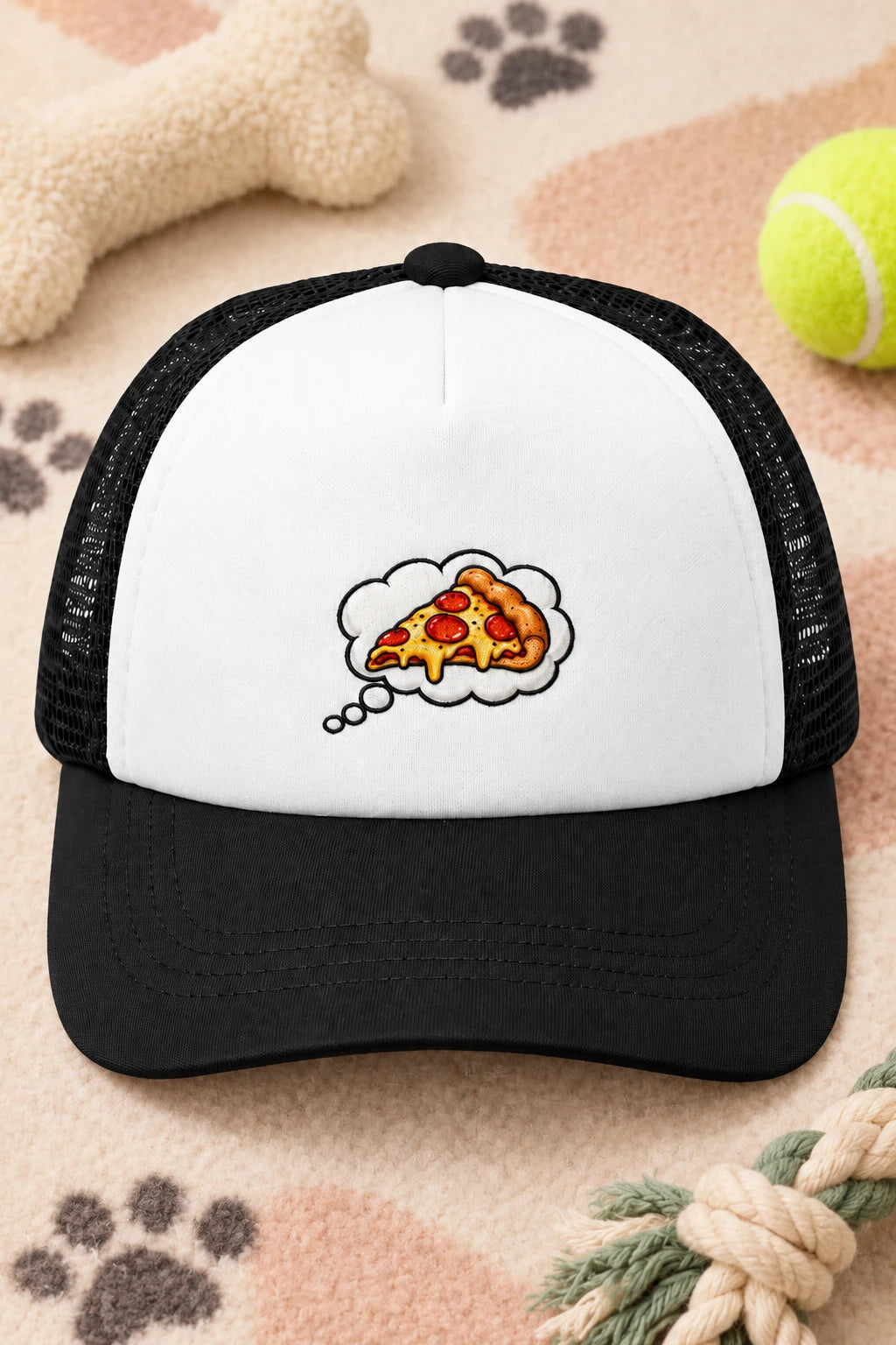Black Pizza Dream dog trucker hat flat lay with white front panel and pizza thought bubble design