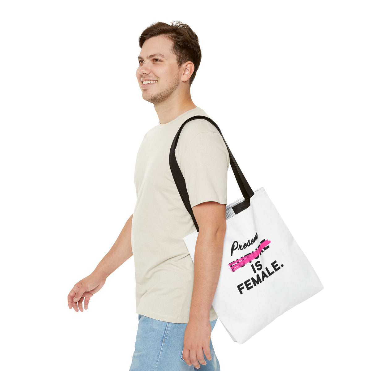 Present Is Female statement tote bag carried in a casual everyday outfit