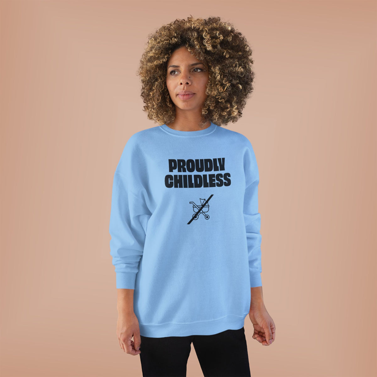 Woman wearing the light blue Proudly Childless Sweatshirt in a clean studio lifestyle image.