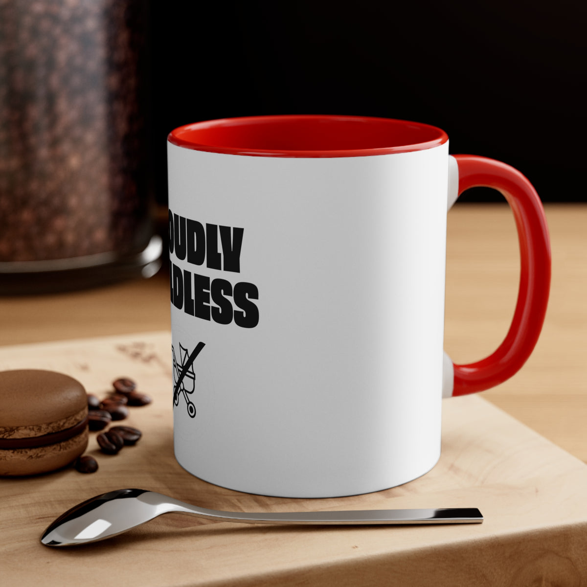 Proudly Childless red accent mug styled with coffee and dessert on a tabletop
