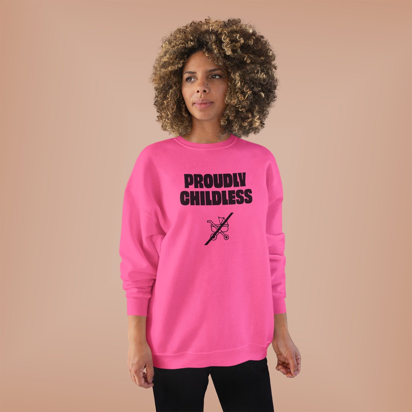 Woman wearing the bright pink Proudly Childless Sweatshirt in a casual front-facing studio look.