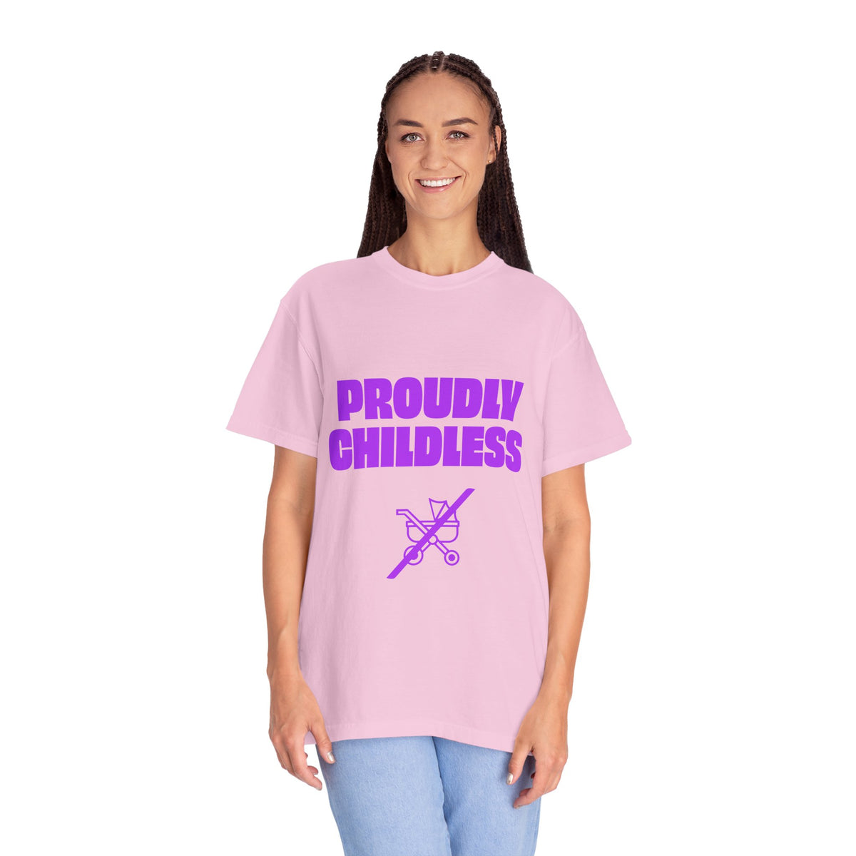 Female model wearing a pink Proudly Childless unisex graphic T-shirt with jeans