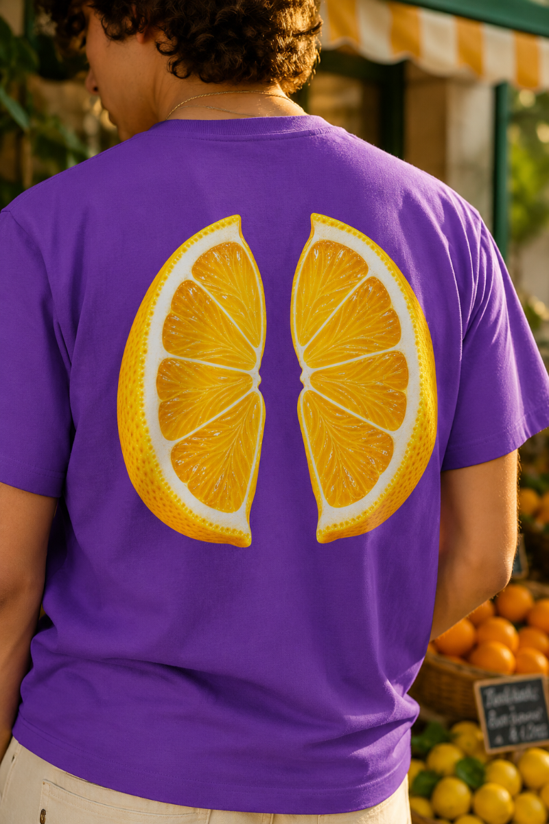 Purple heavyweight cotton T-shirt front view in a youthful citrus-inspired flat lay
