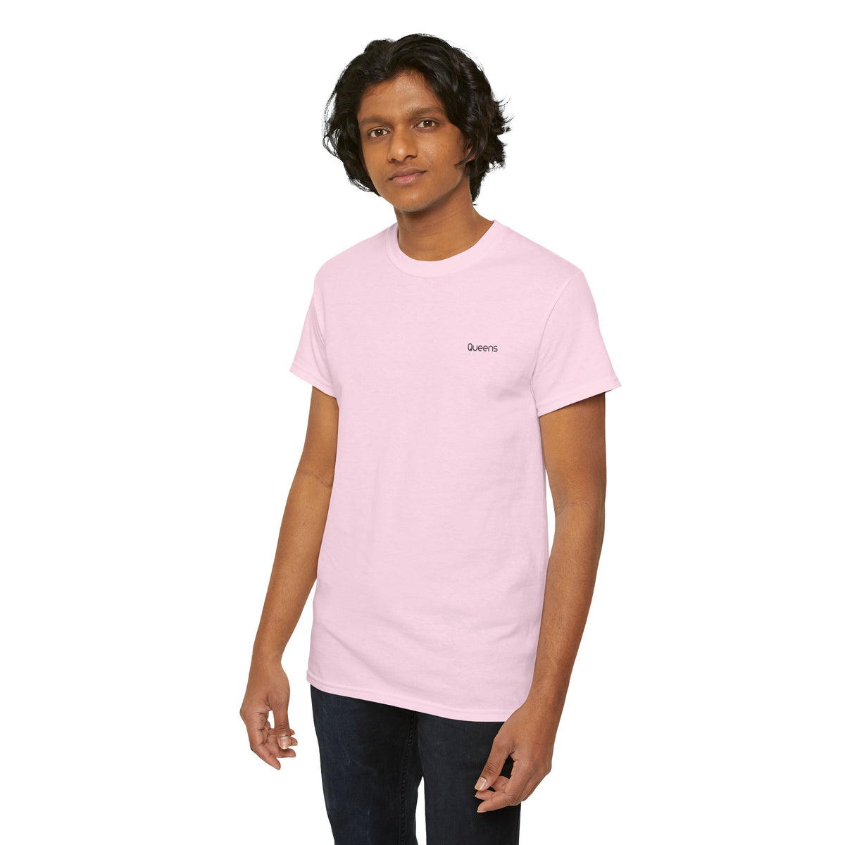 Man modeling a pink Queens crewneck T-shirt with short sleeves and black trousers.