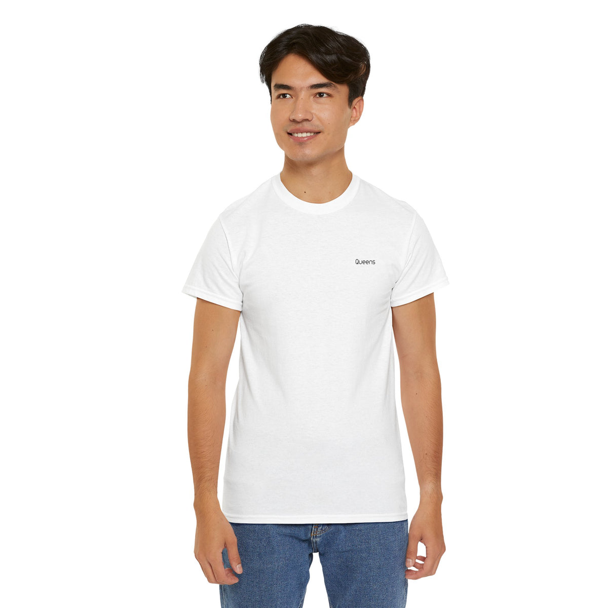 Man modeling a white Queens T-shirt with small black chest lettering and blue jeans.
