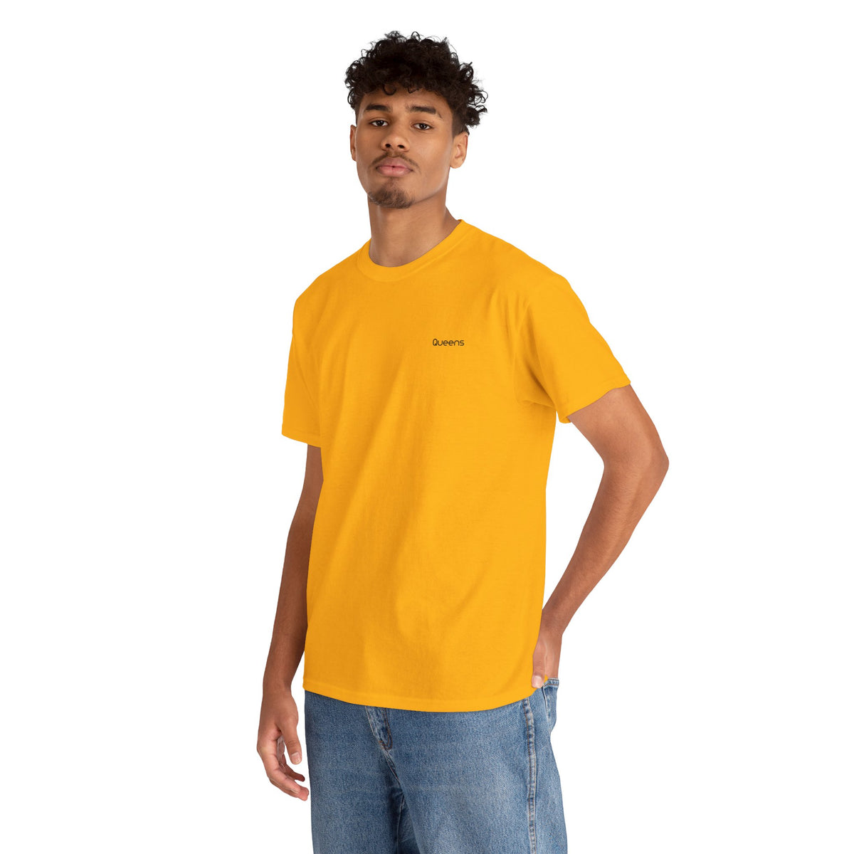 Man modeling a yellow Queens crewneck T-shirt with small black chest lettering and blue jeans.