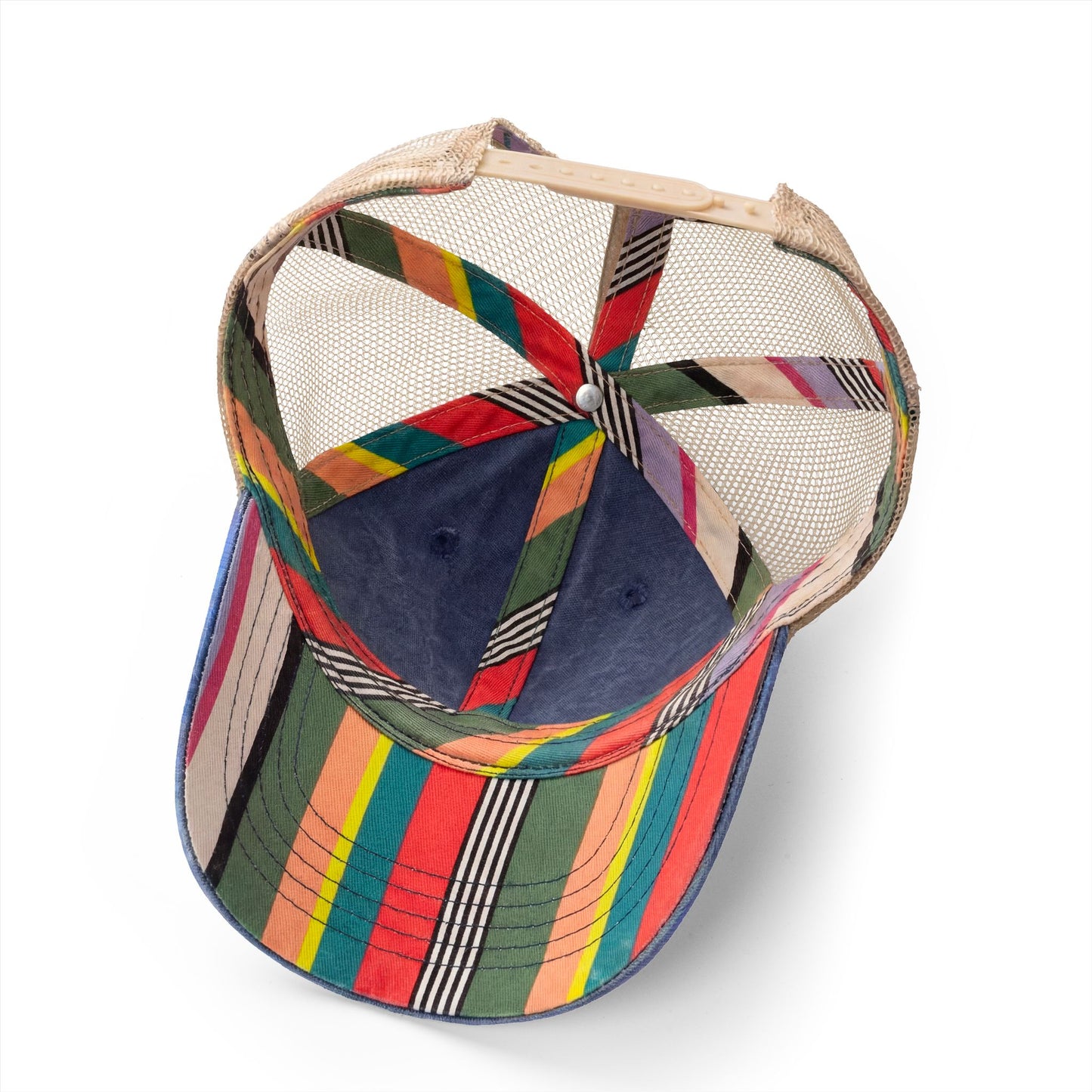 Interior view of rainbow striped mesh trucker hat with colorful panels.