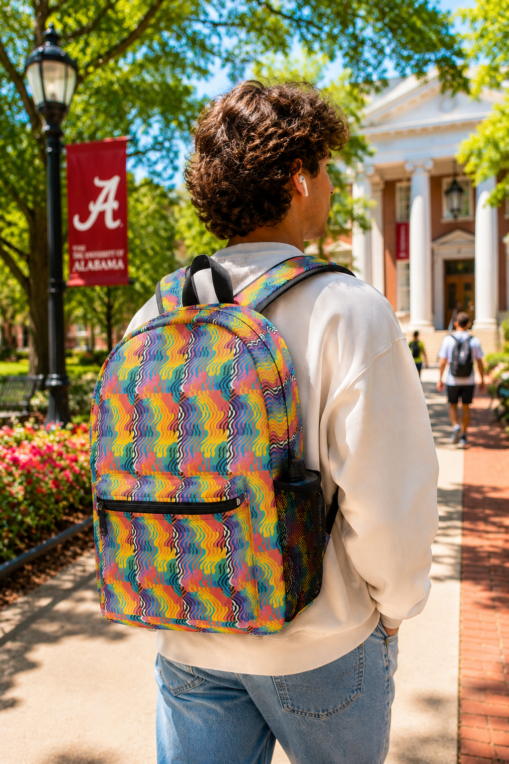 Rainbow Wave backpack worn by student walking on college campus
