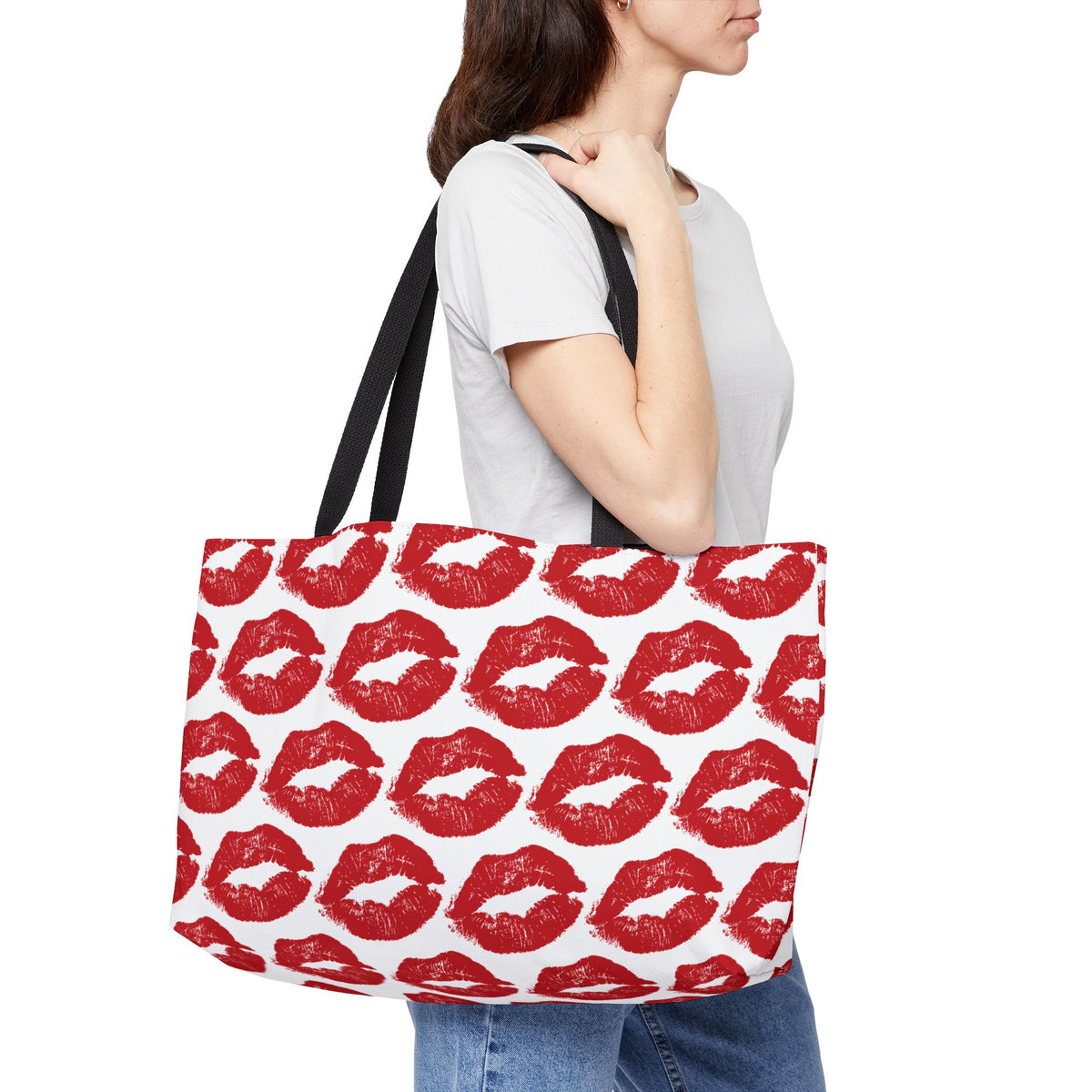 Woman carrying red lips weekender bag with lipstick kiss print