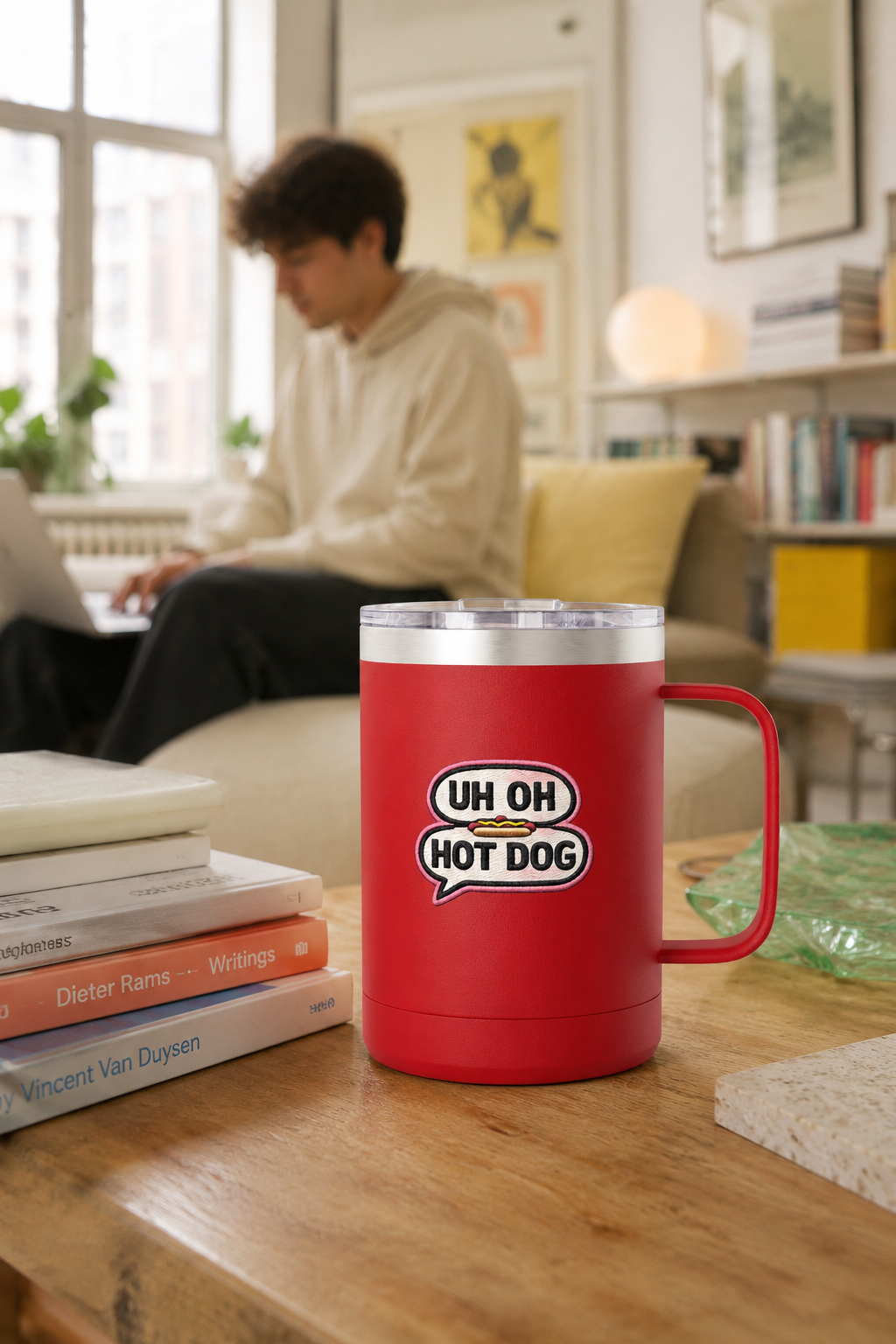 Red Uh Oh Hot Dog MADtv insulated coffee mug on a table in a bright modern apartment