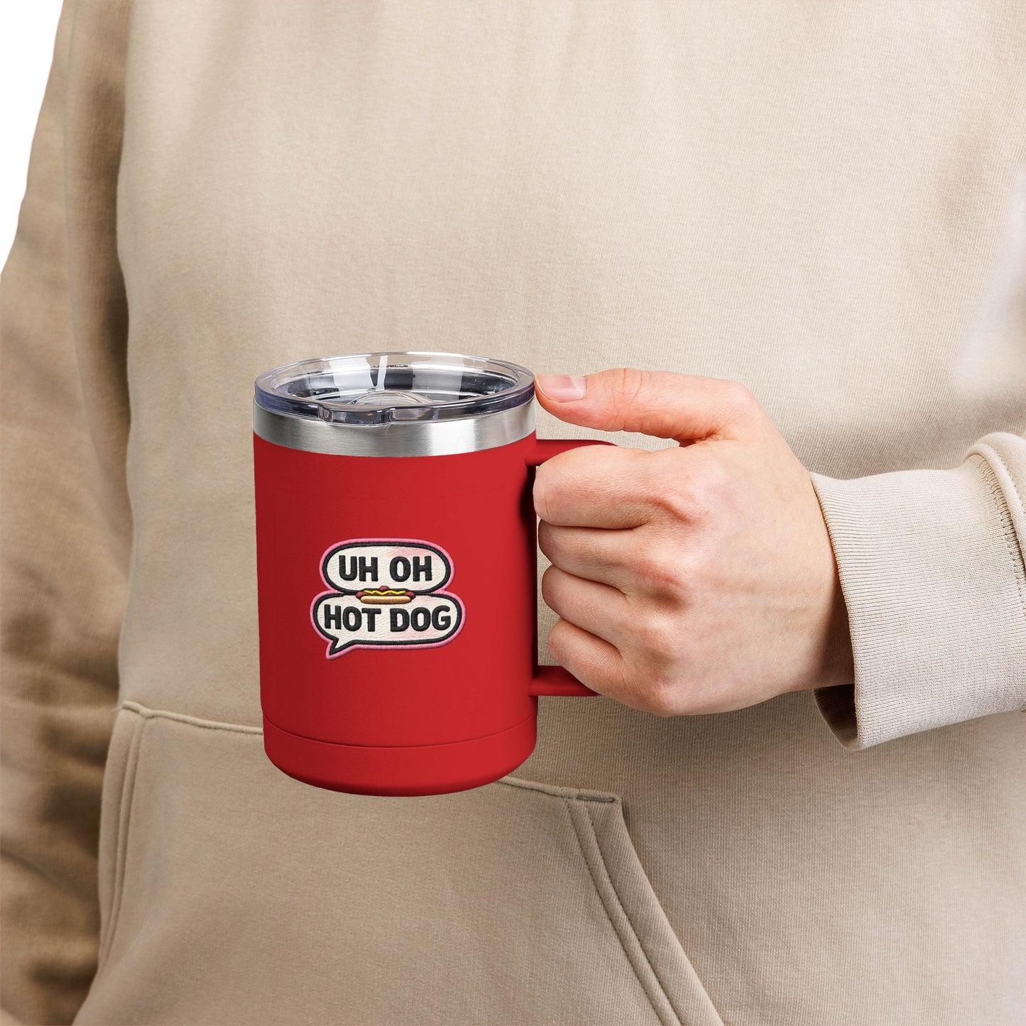 Person holding a red Uh Oh Hot Dog MADtv insulated travel mug with clear lid