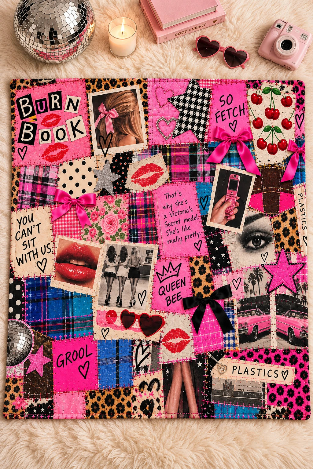 Tantrum Media Regina George Burn Book Sweatshirt Blanket flat lay on a cream rug with retro pink accessories, showing its scrapbook collage design.