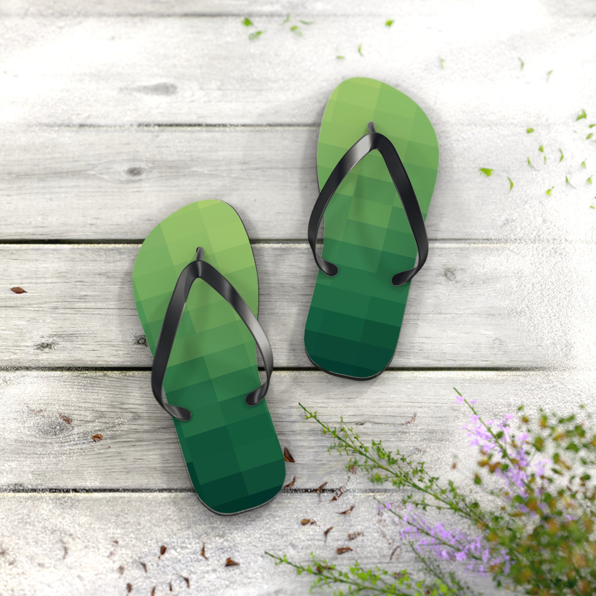Green retro gaming flip flops photographed on rustic wood surface with soft natural summer lighting
