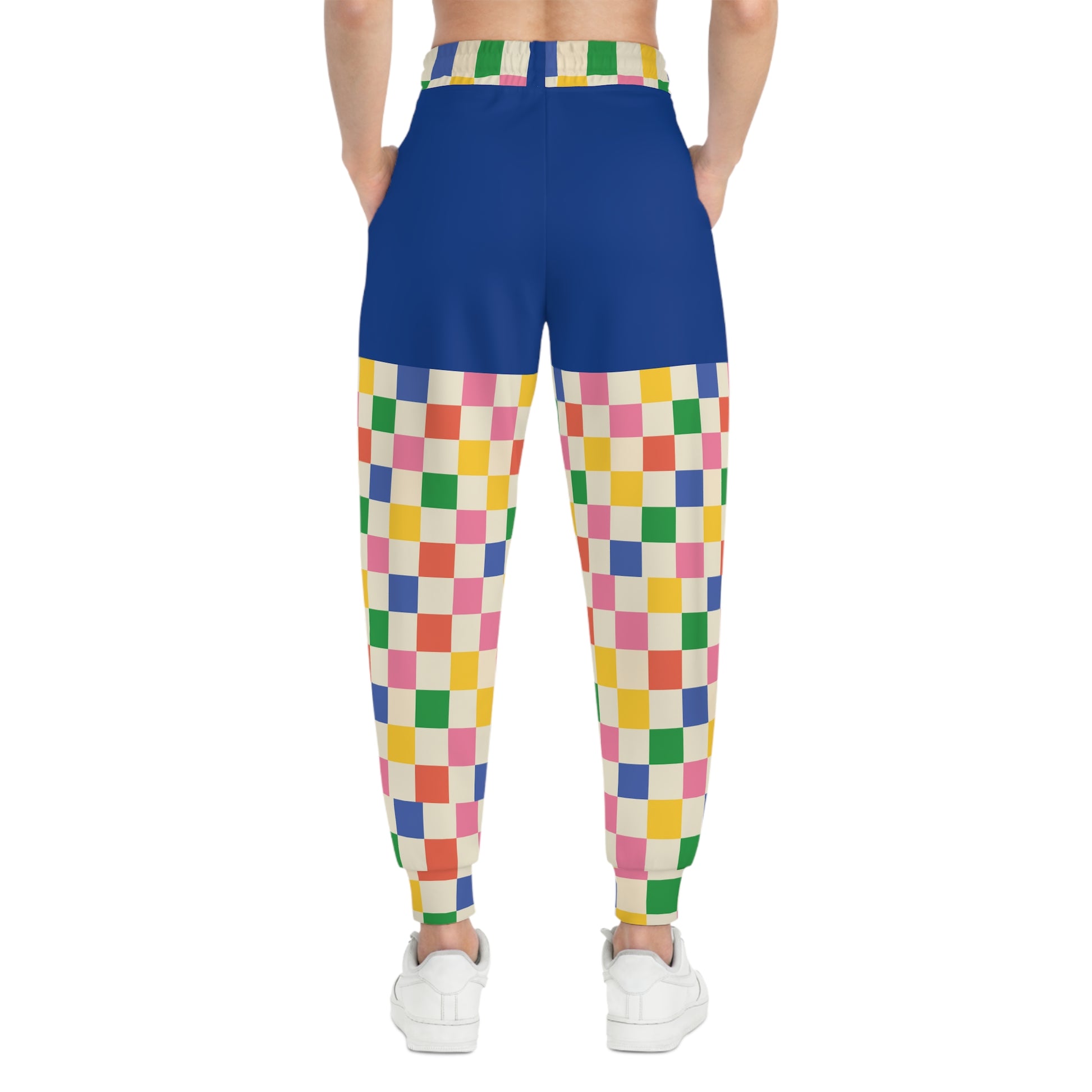 Back model view of Retro Pop Joggers featuring vibrant checkerboard print, tapered cuffs, and comfortable unisex streetwear fit.