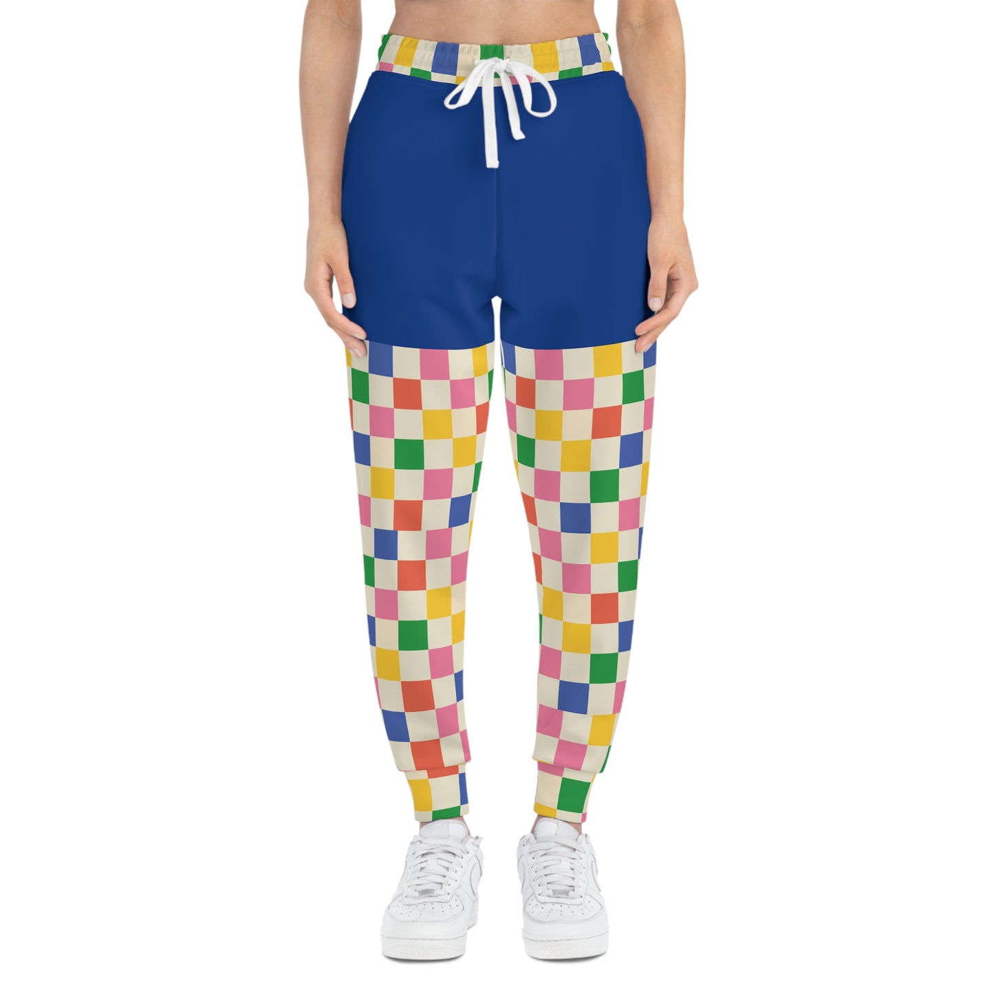 Front model view of Retro Pop Joggers highlighting colorful checkerboard pattern, soft fabric, and relaxed streetwear silhouette.
