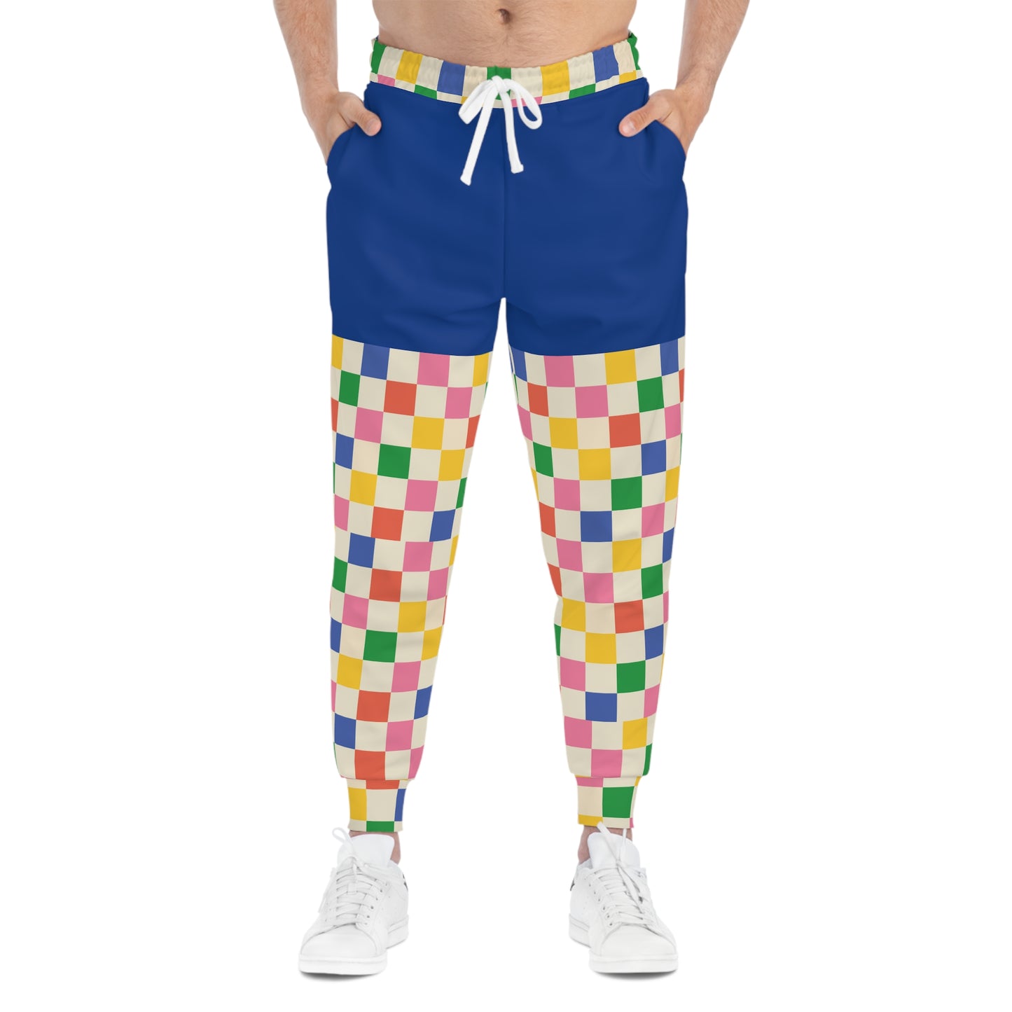 Model wearing Retro Pop Joggers from the front, displaying colorful checkerboard design and playful retro gaming fashion aesthetic.