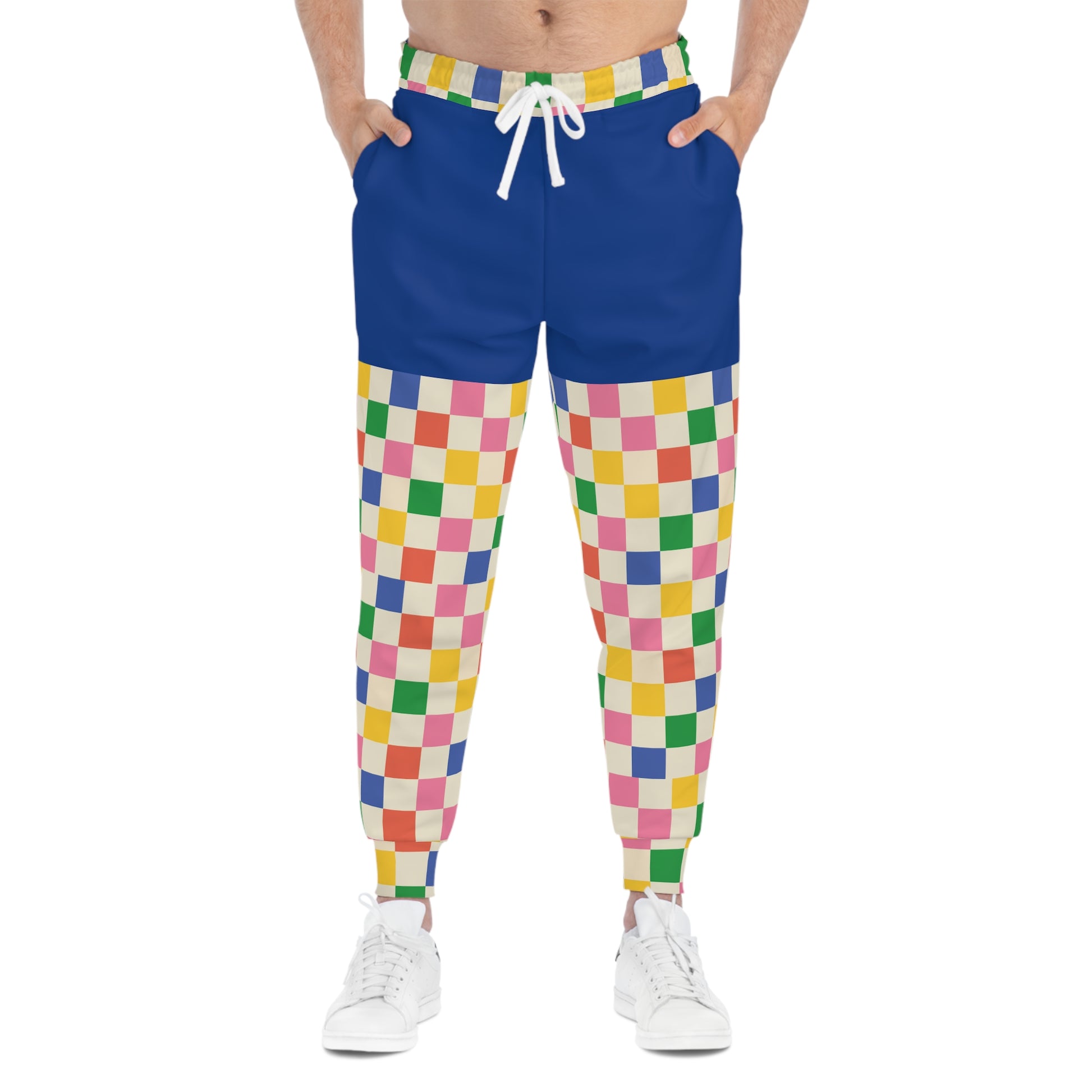 Model wearing Retro Pop Joggers from the front, displaying colorful checkerboard design and playful retro gaming fashion aesthetic.