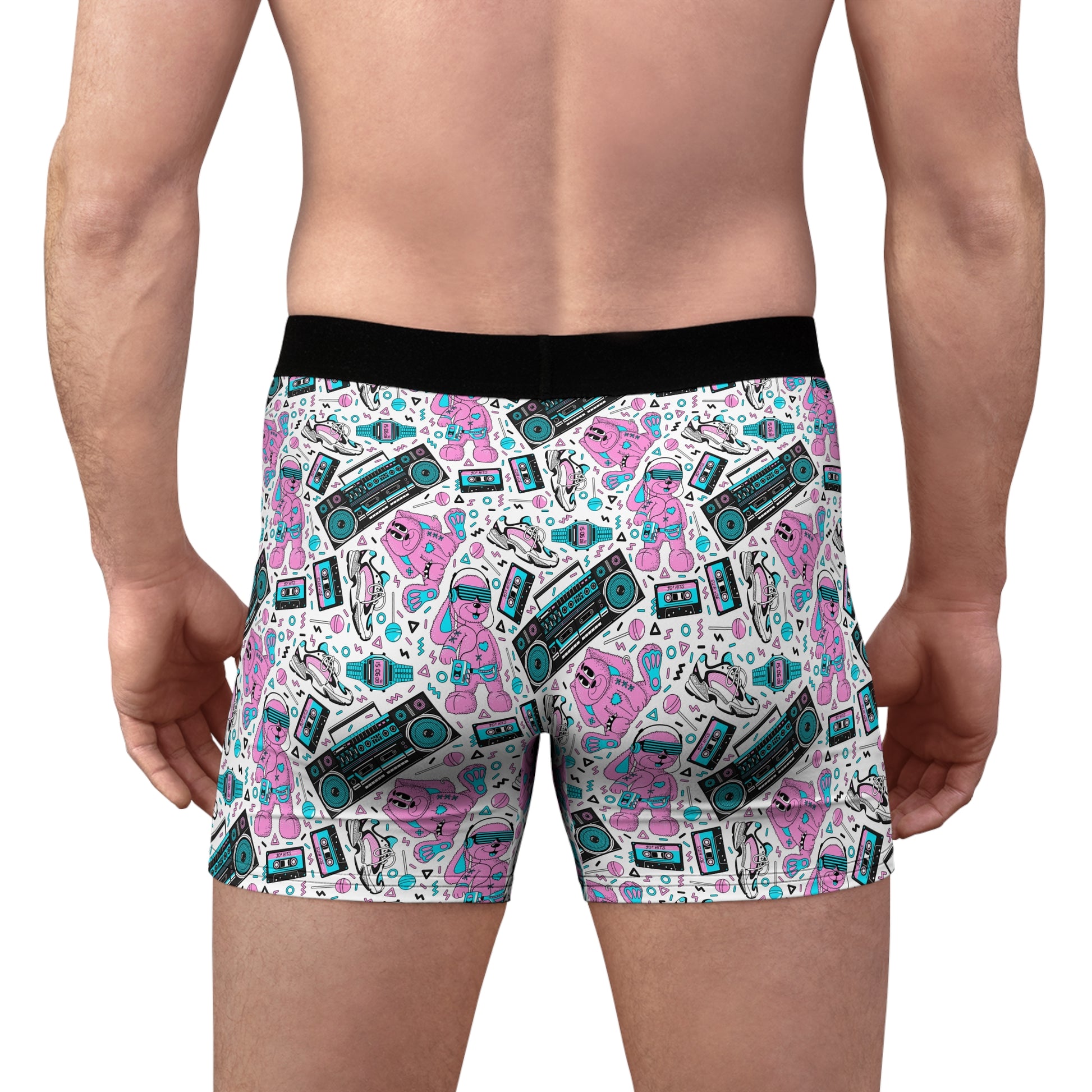 Male model wearing retro pop men’s boxer briefs with colorful 80s-inspired graphic print, back view