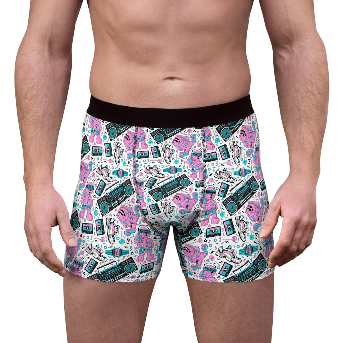 Male model wearing retro pop men’s boxer briefs with colorful cassette and boombox print, front view