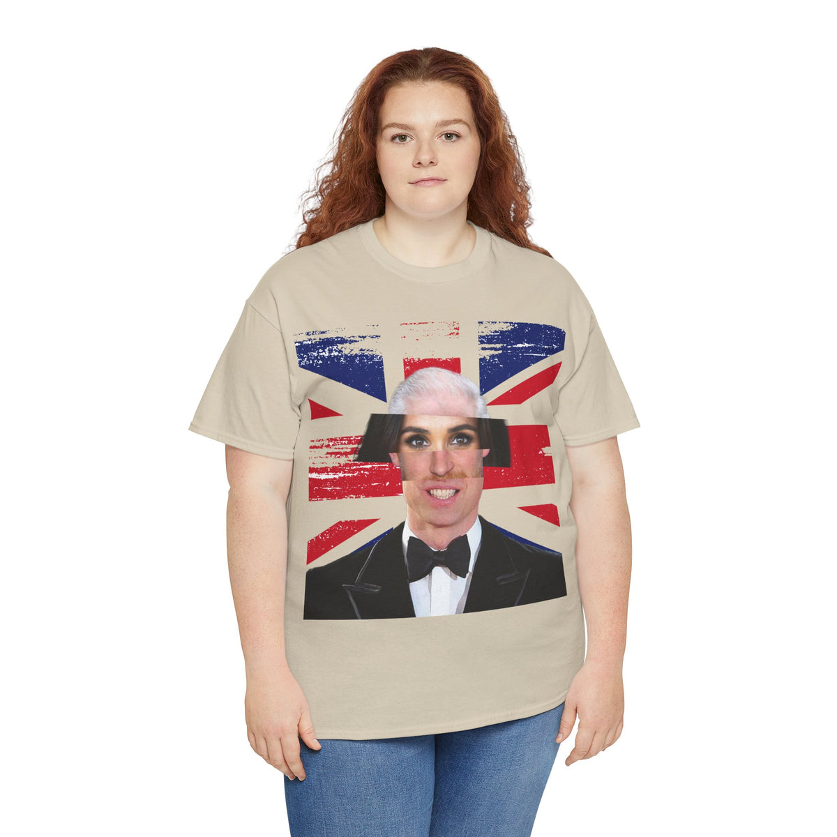 Red-haired woman wearing the sand Tantrum Media Royal Frankenstein T-Shirt with blue jeans against a white background.