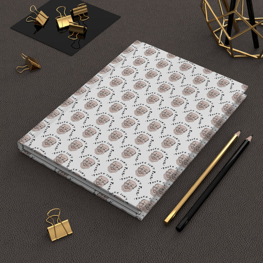Rudy Giuliani Truth Isn’t Truth hardcover journal styled on a dark desk with pens and office accessories